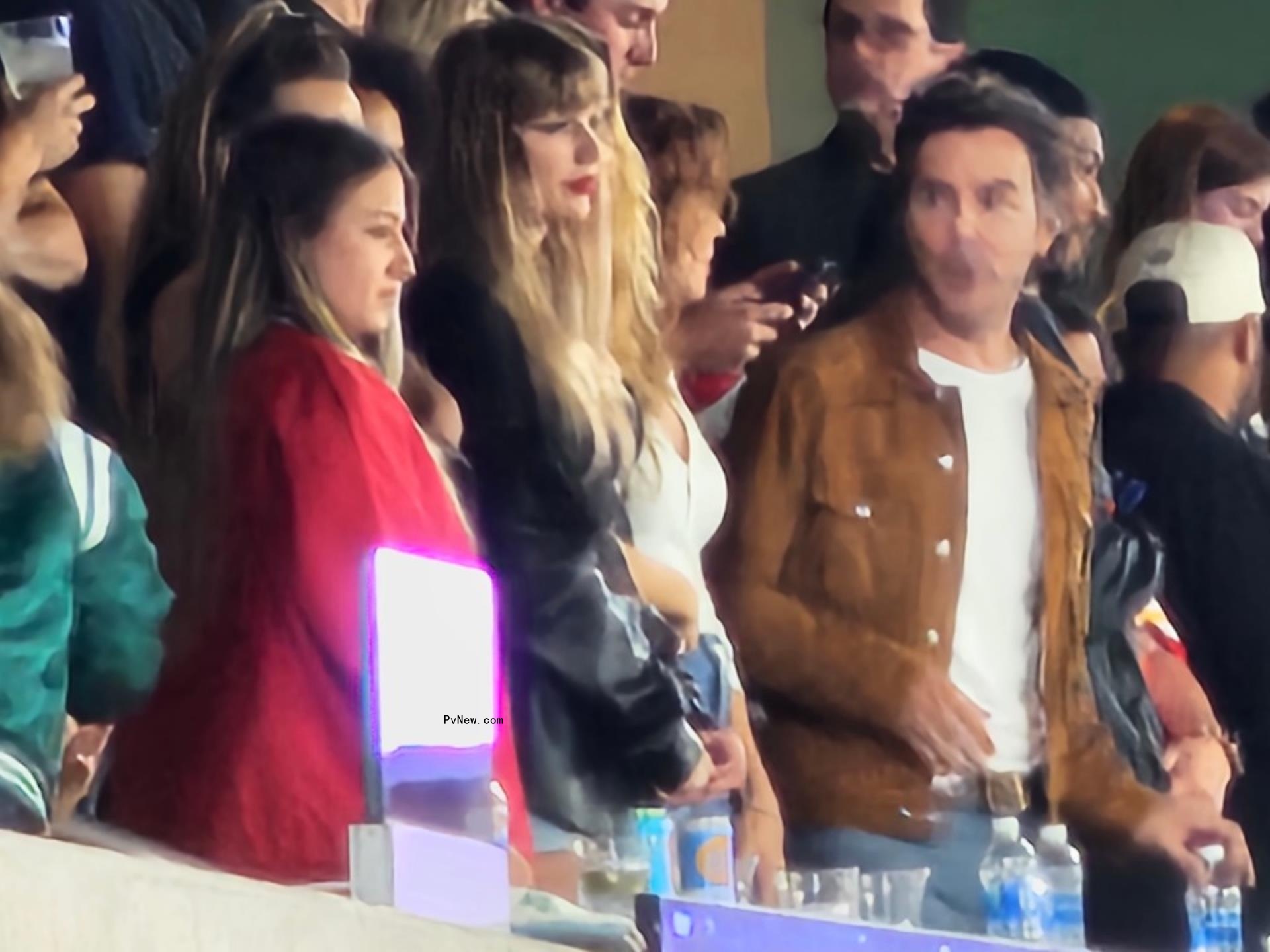 Shawn Levy, Taylor Swift and others inside a private suite at MetLife stadium.