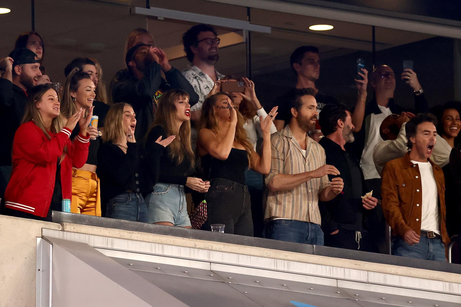 Shawn Levy, Taylor Swift and others inside a private suite at MetLife stadium.