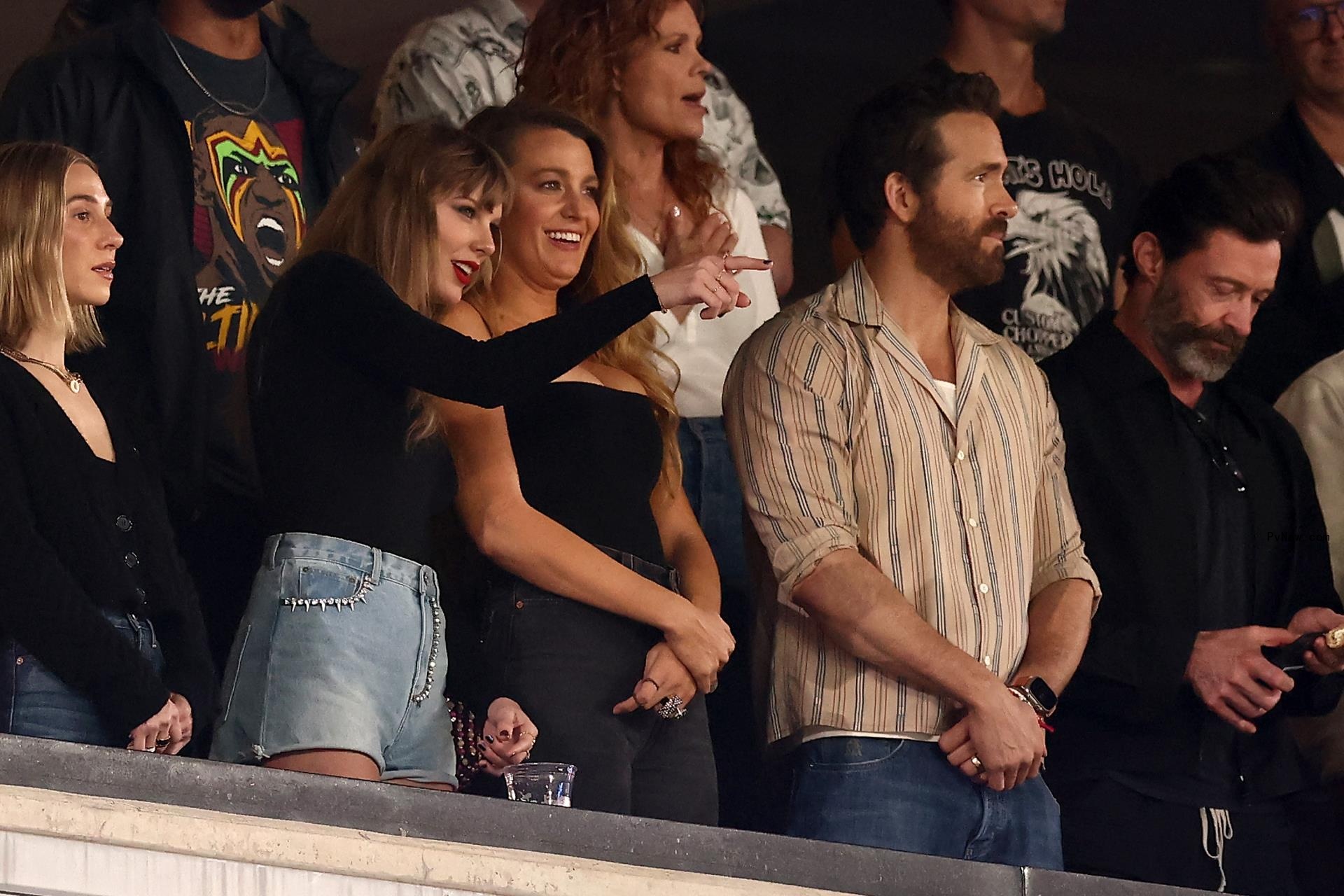 Taylor Swift watching an NFL game with Blake Lively and Ryan Reynolds.