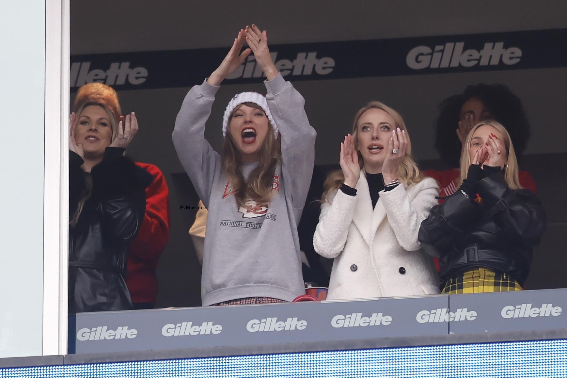 Taylor Swift cheering for Travis Kelce.