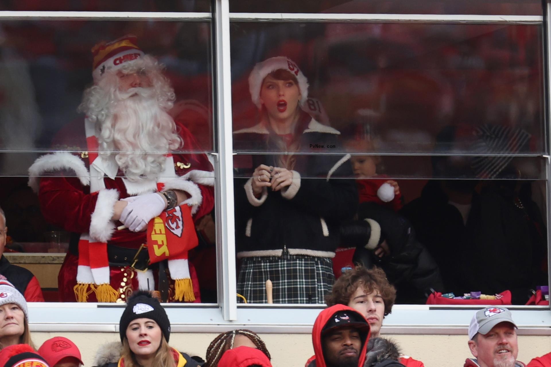 Austin Swift and Taylor Swift watching a Chiefs game