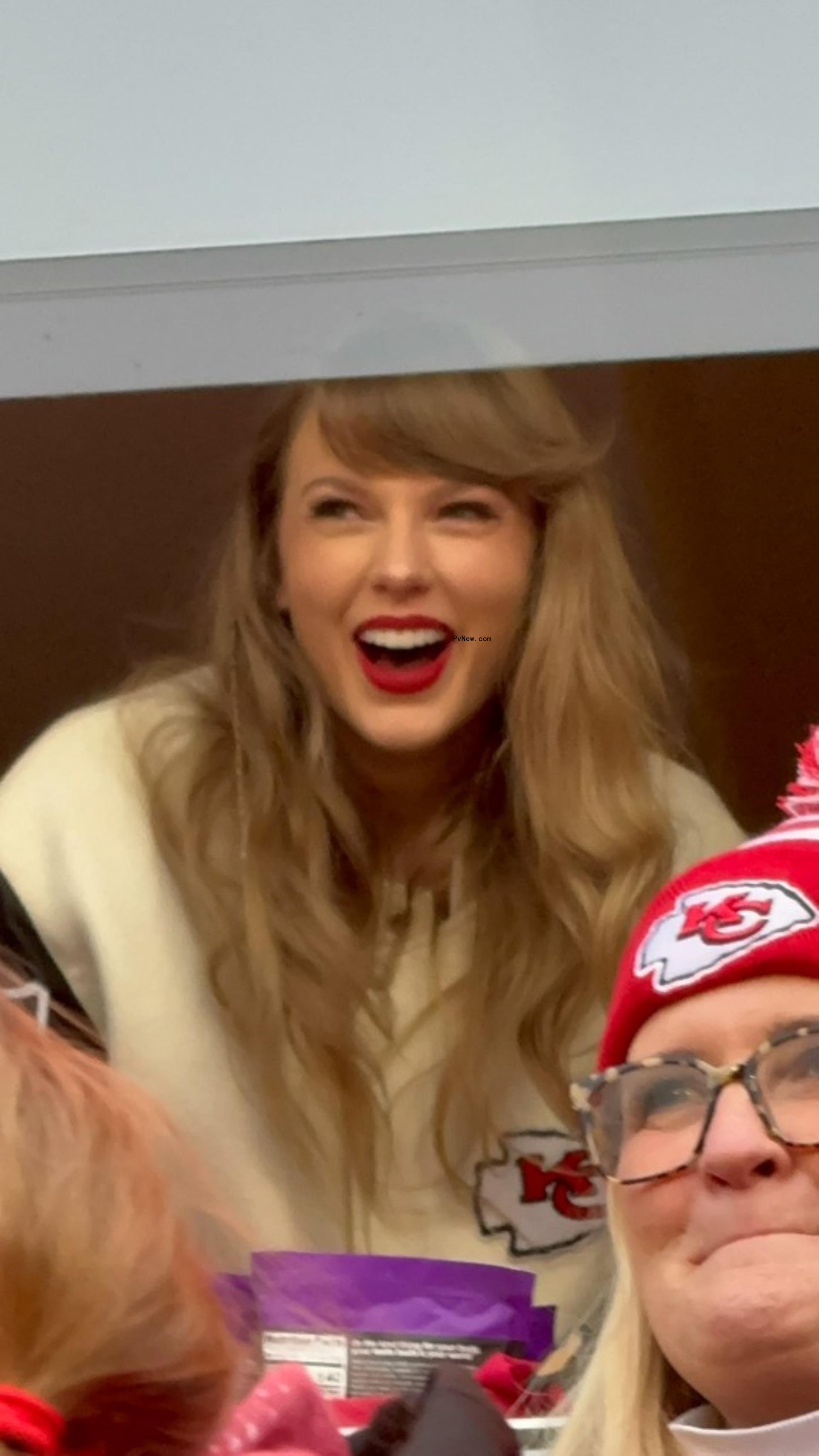 Taylor Swift smiling at Chiefs game