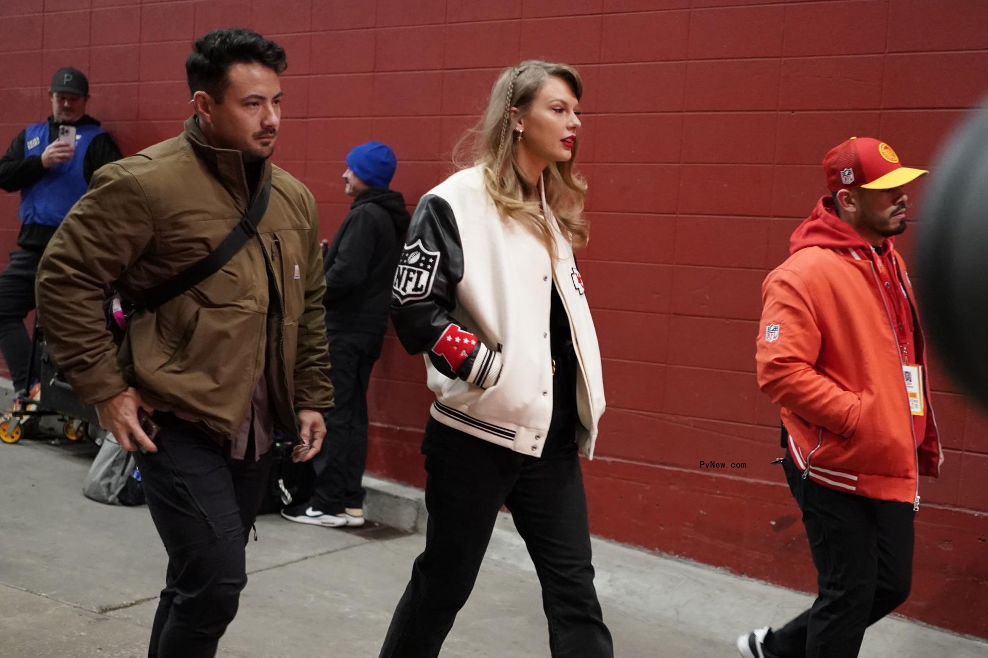 Taylor Swift in a Chiefs jacket.