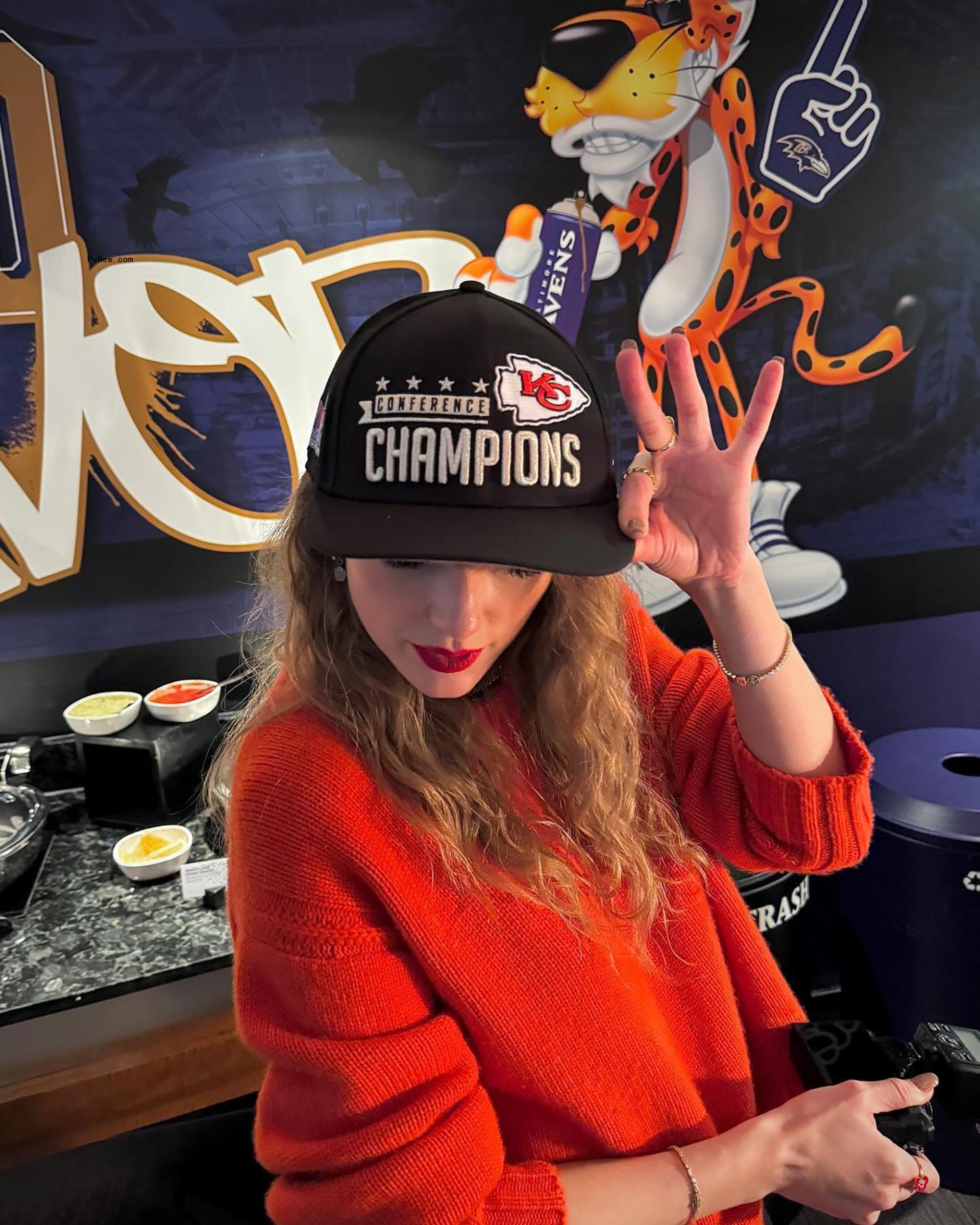 Taylor swift in the AFC Champions hat