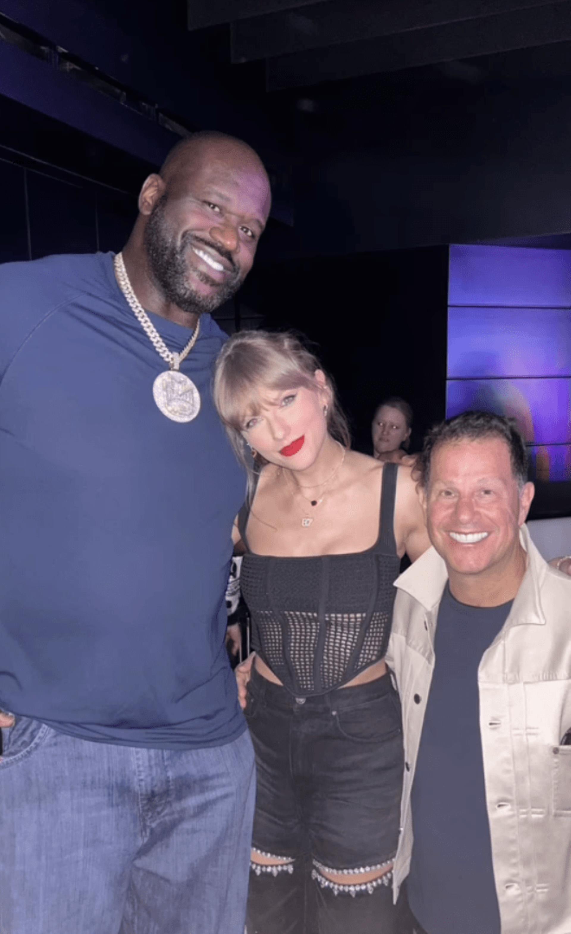 Shaq posing with Taylor Swift and Authentic Brands Group CEO Jamie Salter