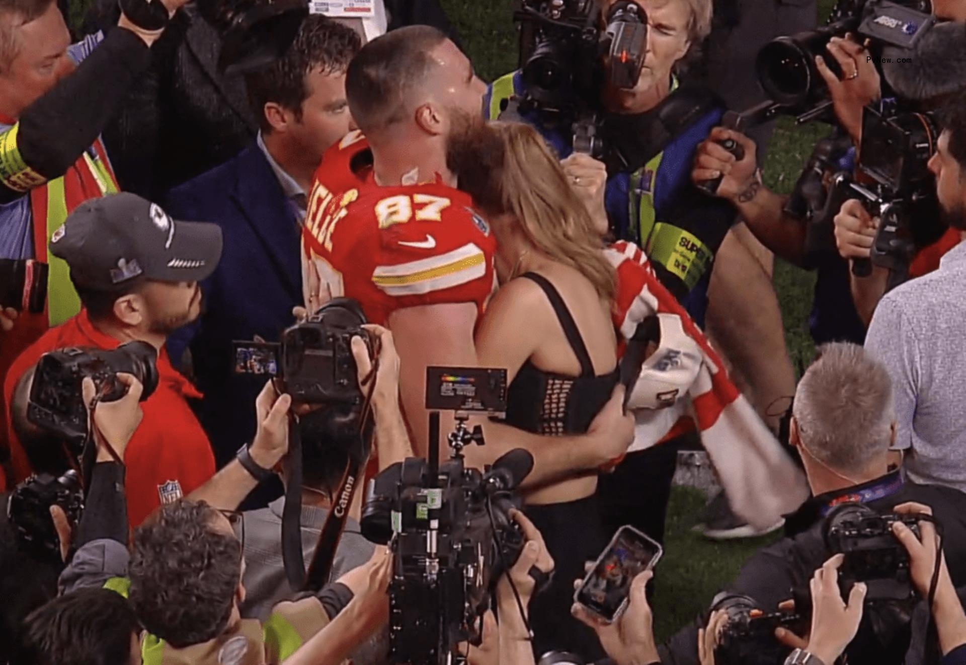 Taylor Swift and Travis Kelce kissing after Super Bowl 2024.