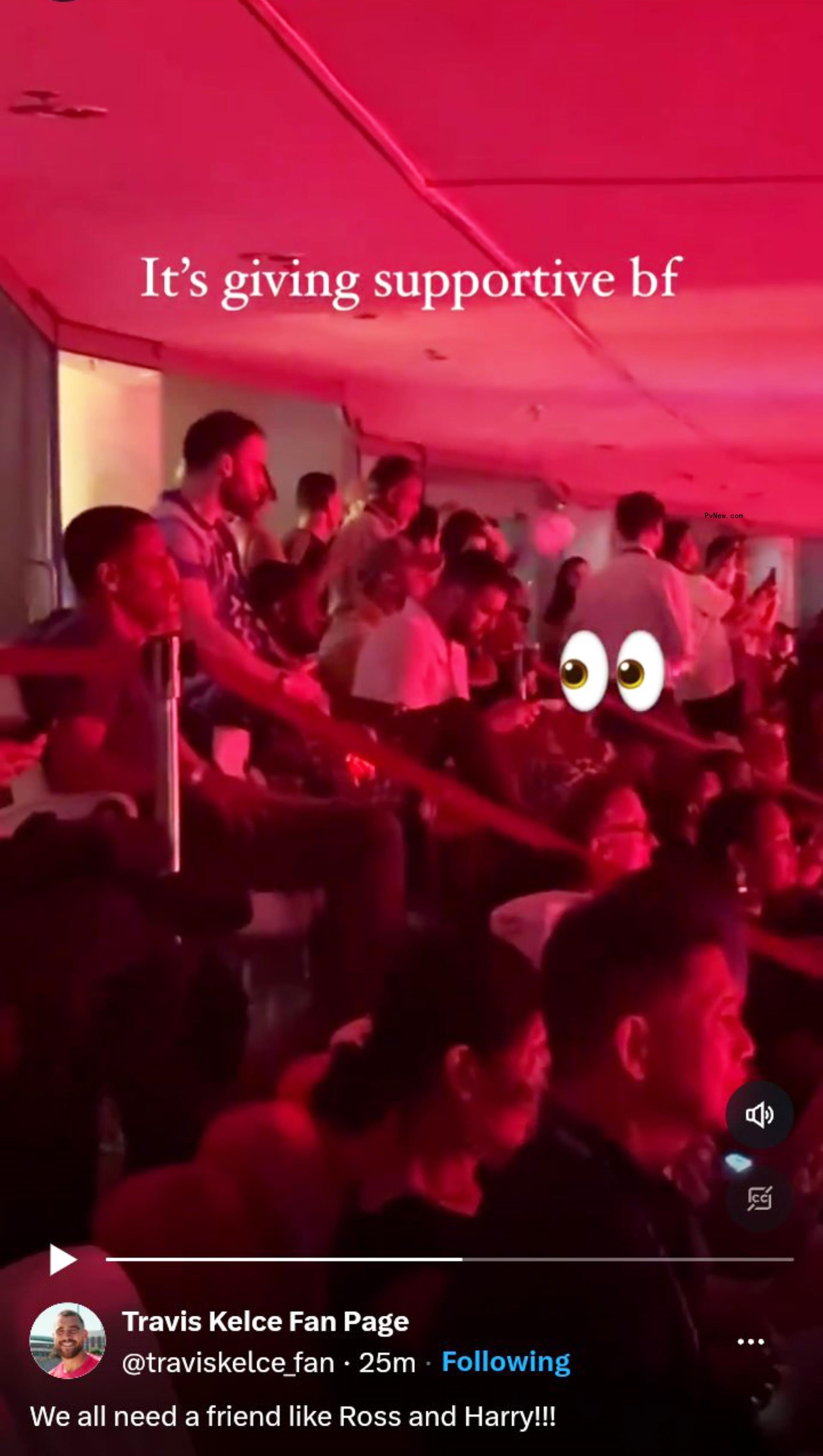 Travis Kelce on his phone during Taylor Swift's show.