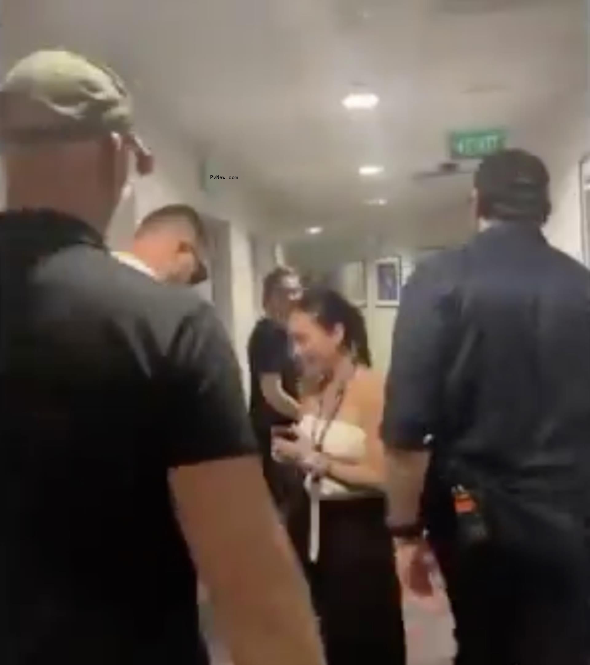 Travis Kelce giving a fan a friendship bracelet