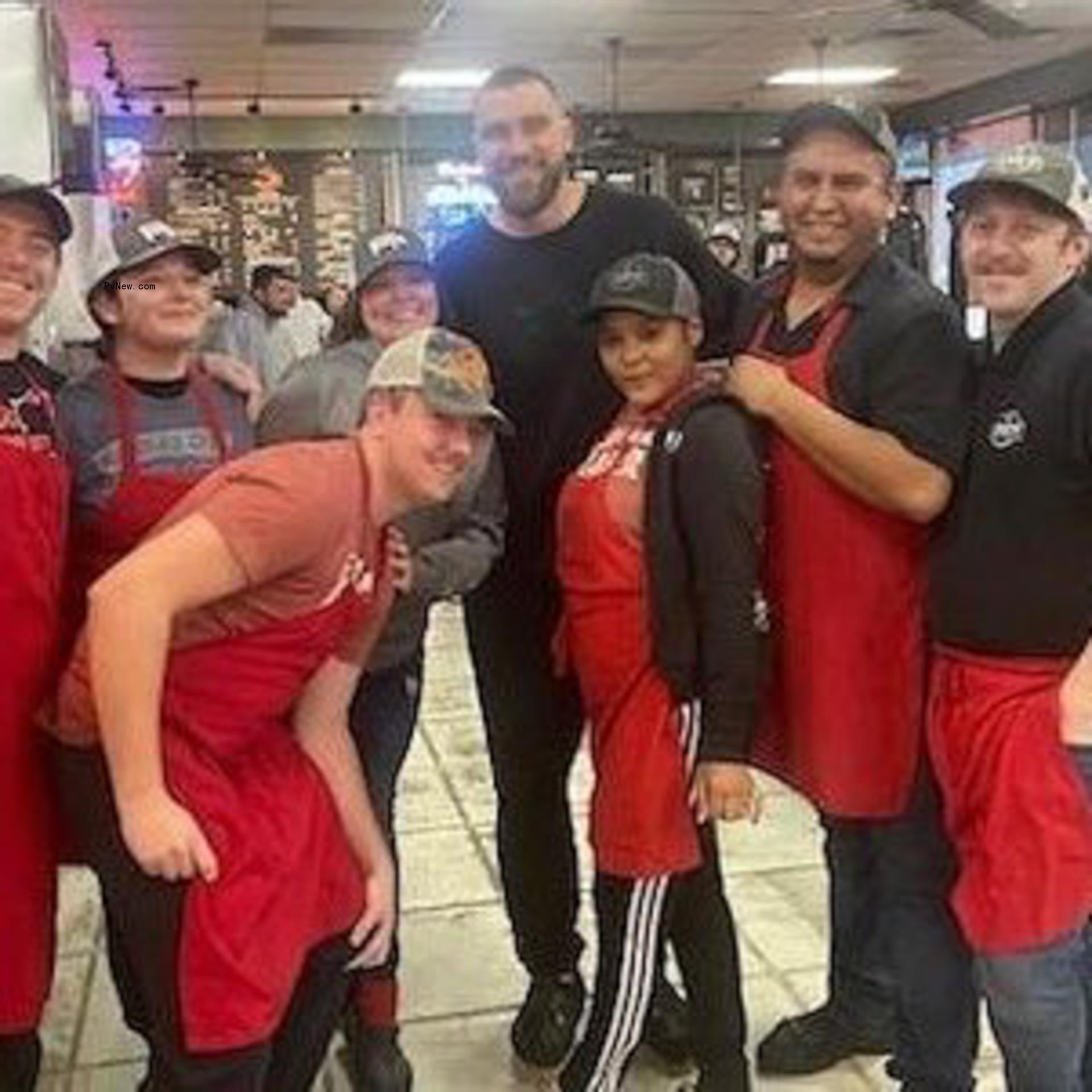 Travis Kelce and restaurant workers