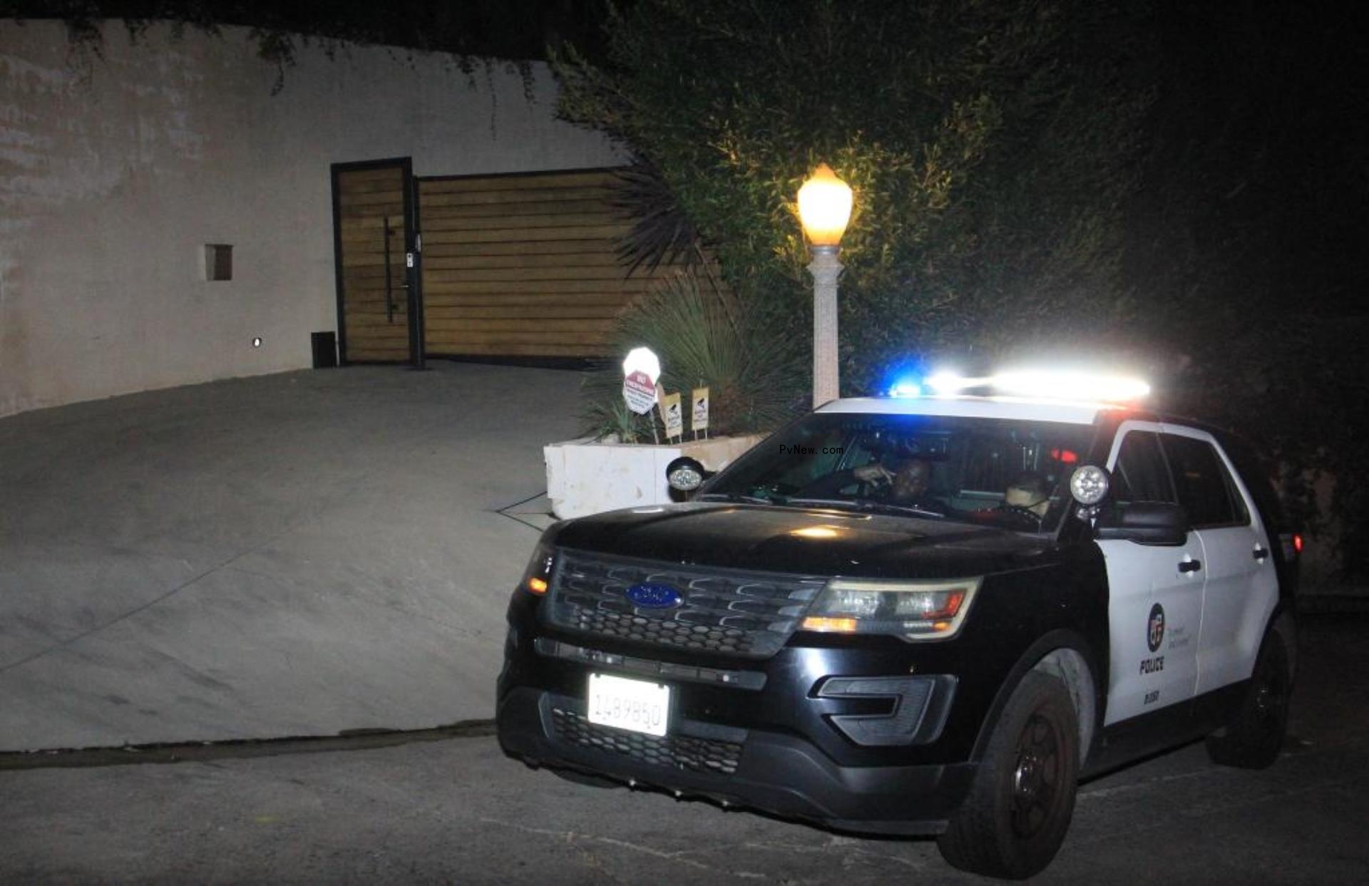 two police officers sitting in a police SUV