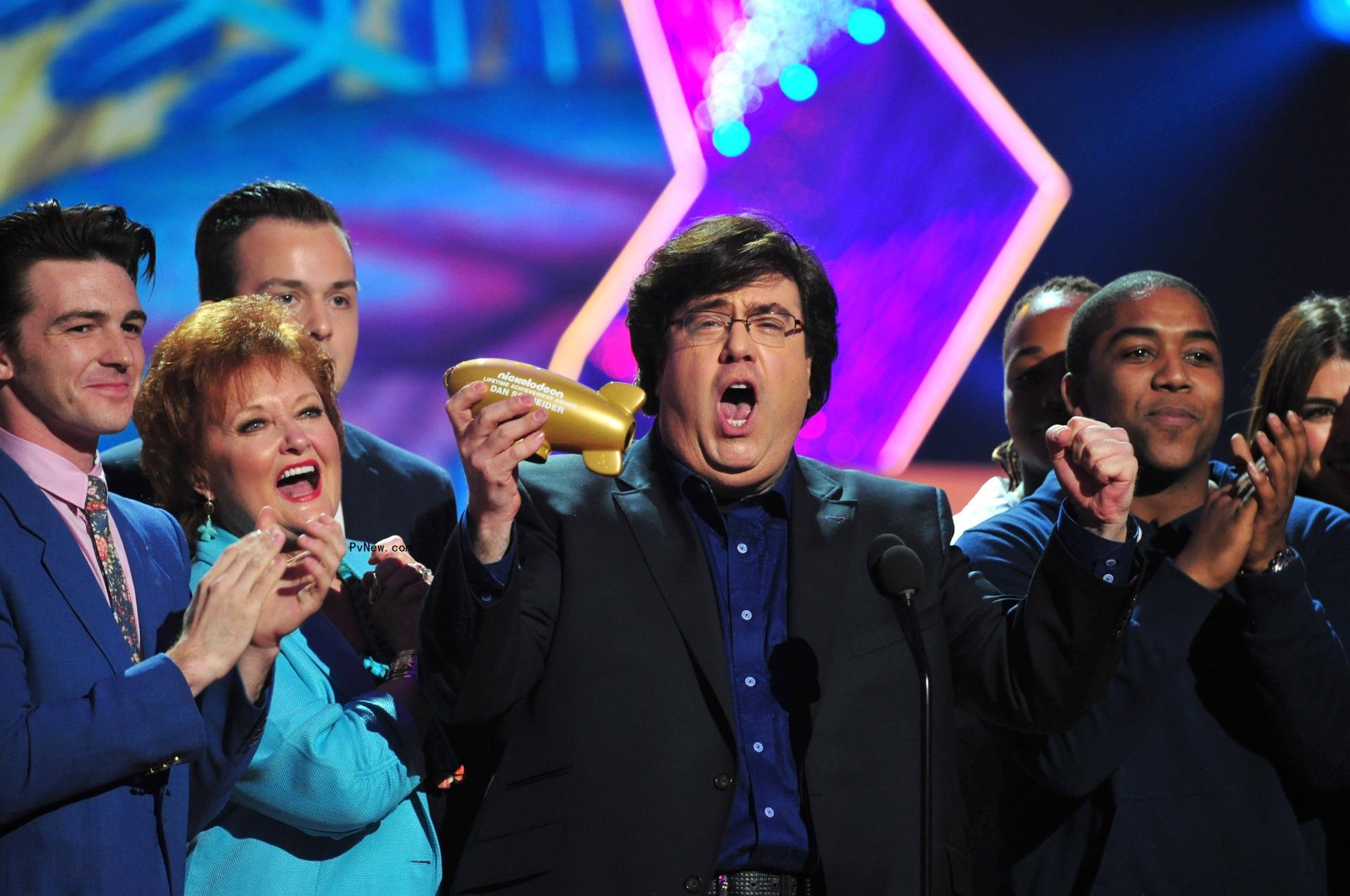 Dan Schneider happy at an award show.
