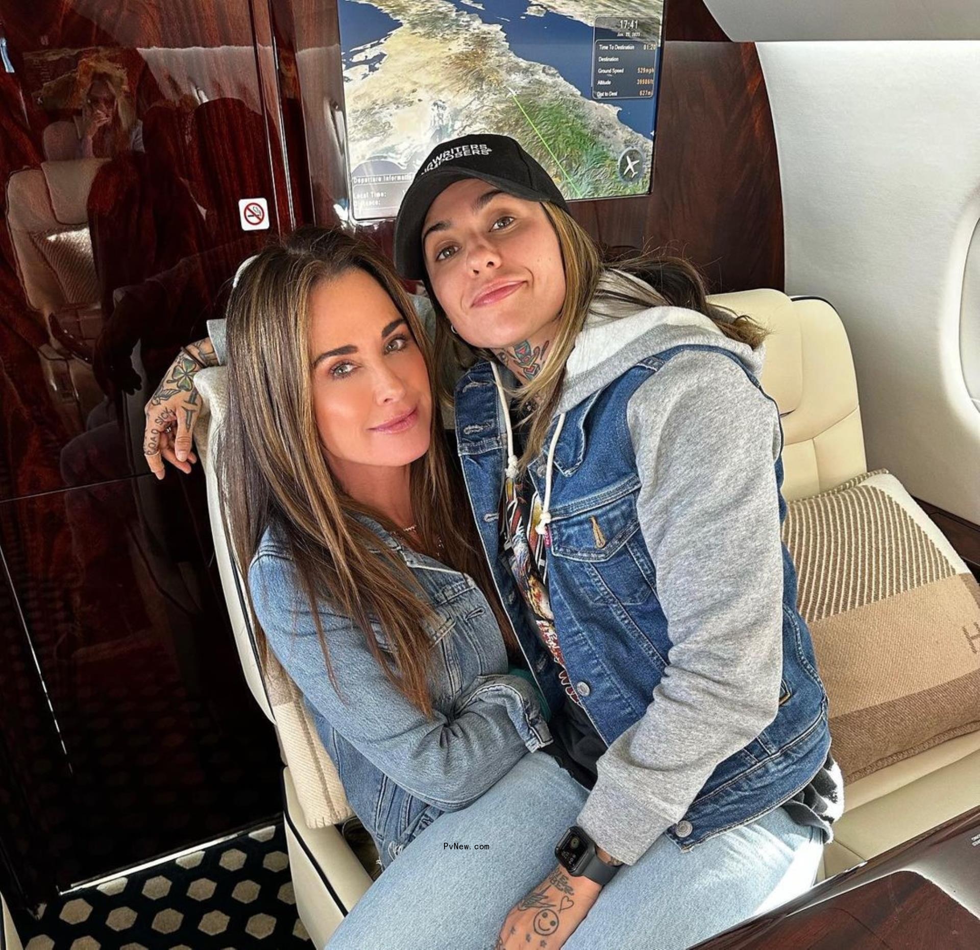 morgan wade sitting on kyle richards on a private jet