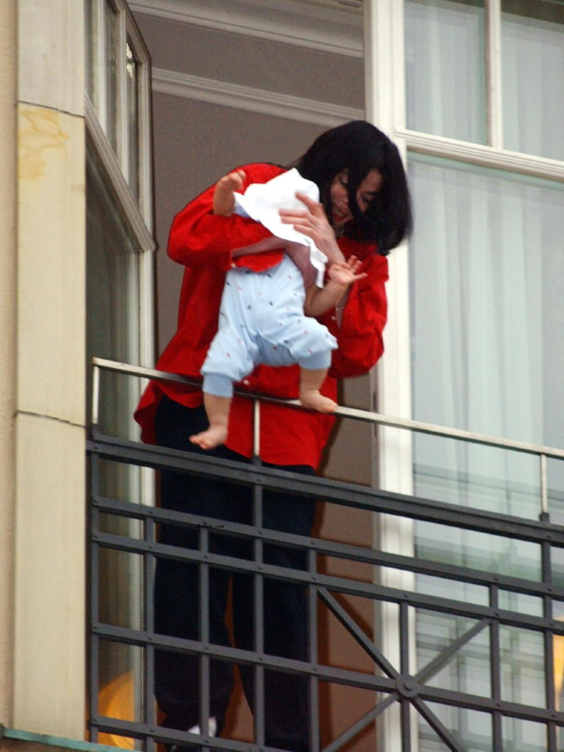 Michael Jackson and his youngest son as a baby