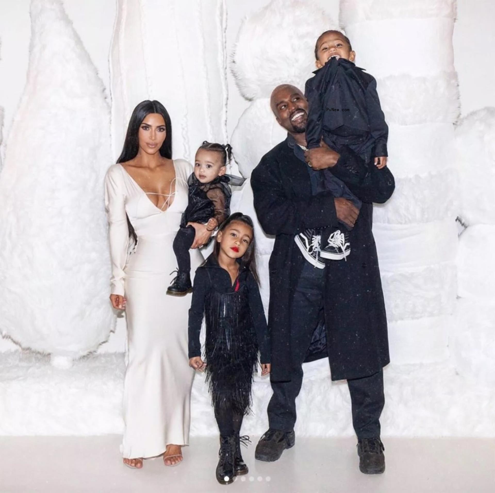 Kim Kardashian and Kanye West with their kids