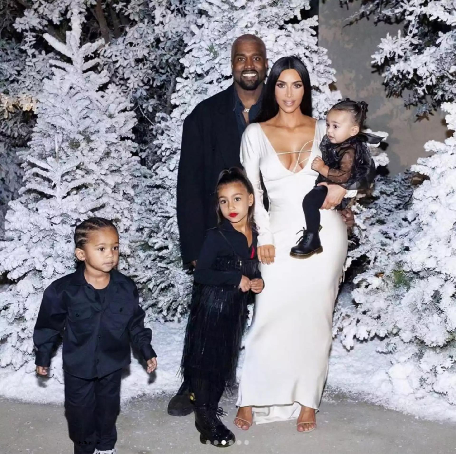 Kim Kardashian and Kanye West with their kids