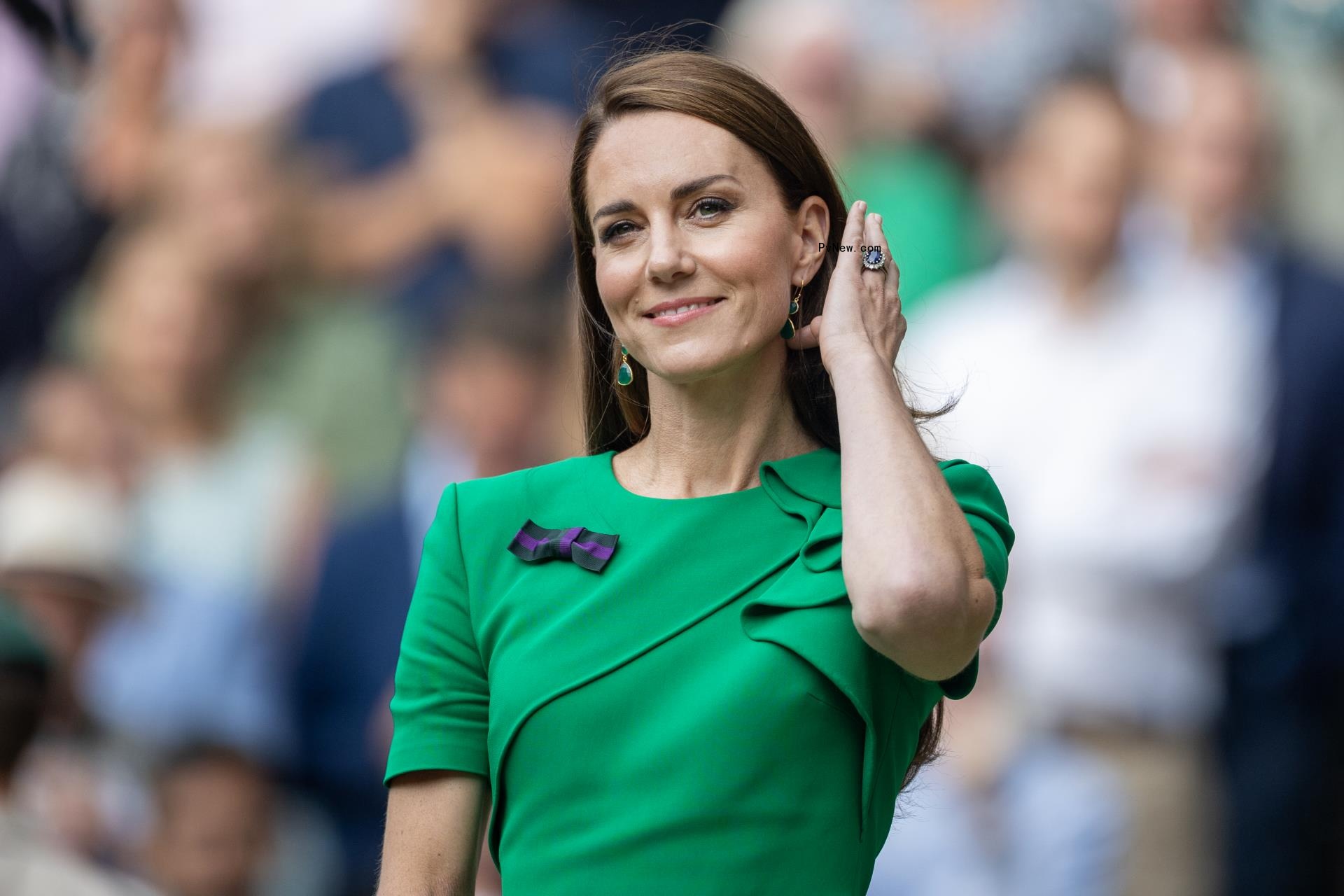 Kate Middleton in a green dress.