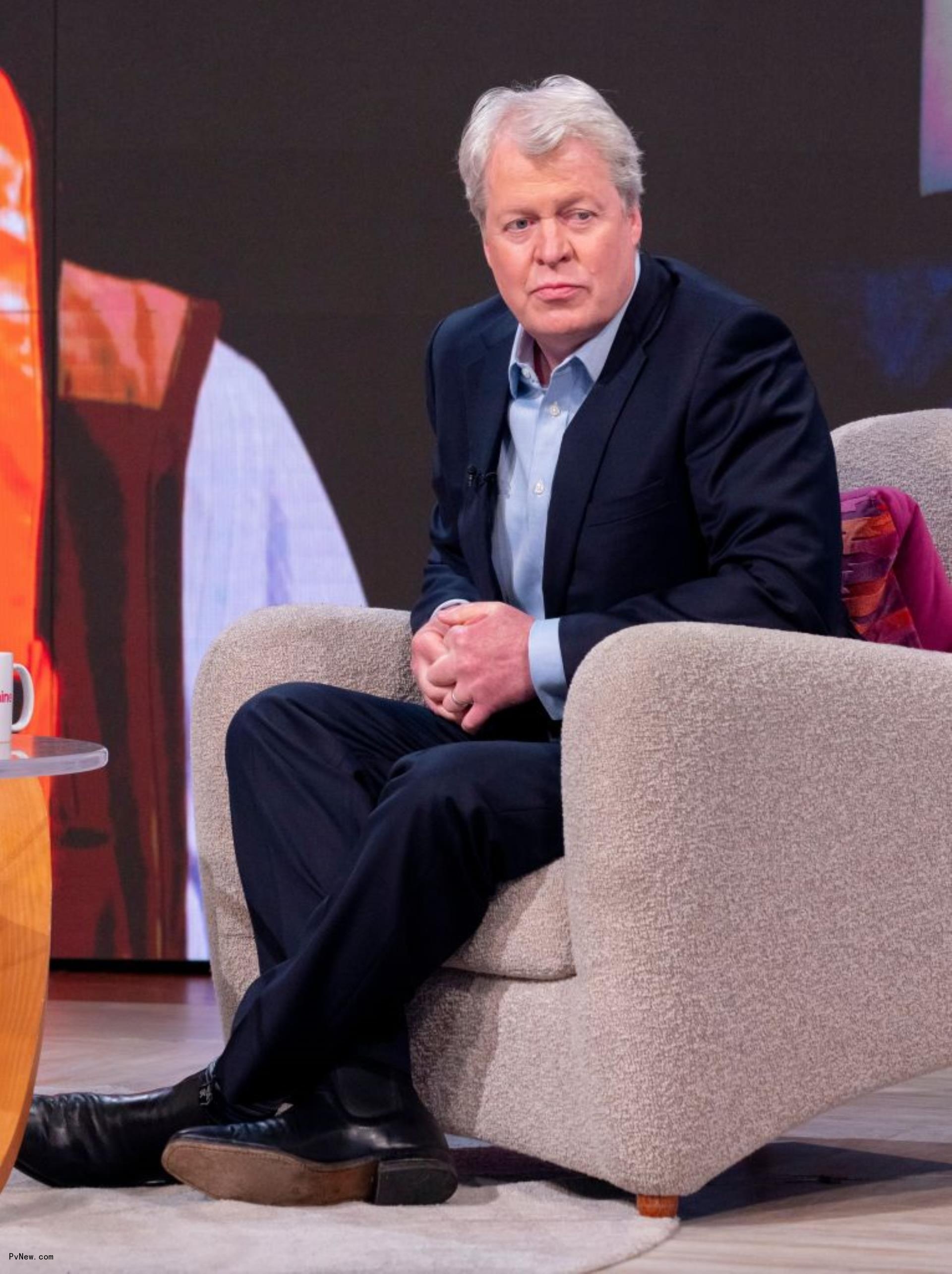 Charles Spencer sitting.