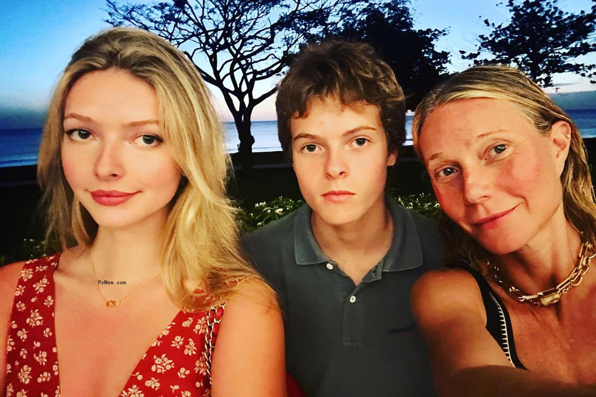 Gwyneth Paltrow and children in a selfie in front of an ocean.