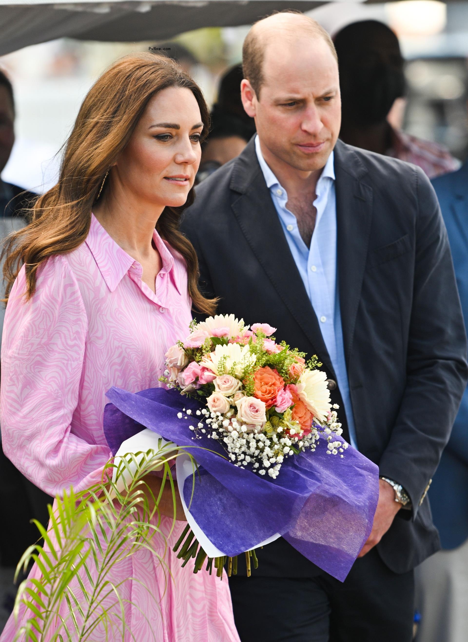 Kate Middleton holding flowers alo<i></i>ngside Prince William.