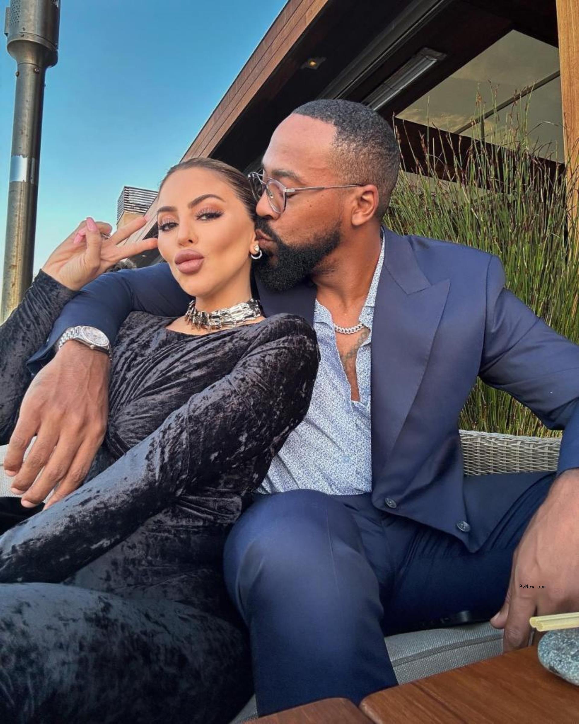 Larsa Pippen and Marcus Jordan cuddling. 