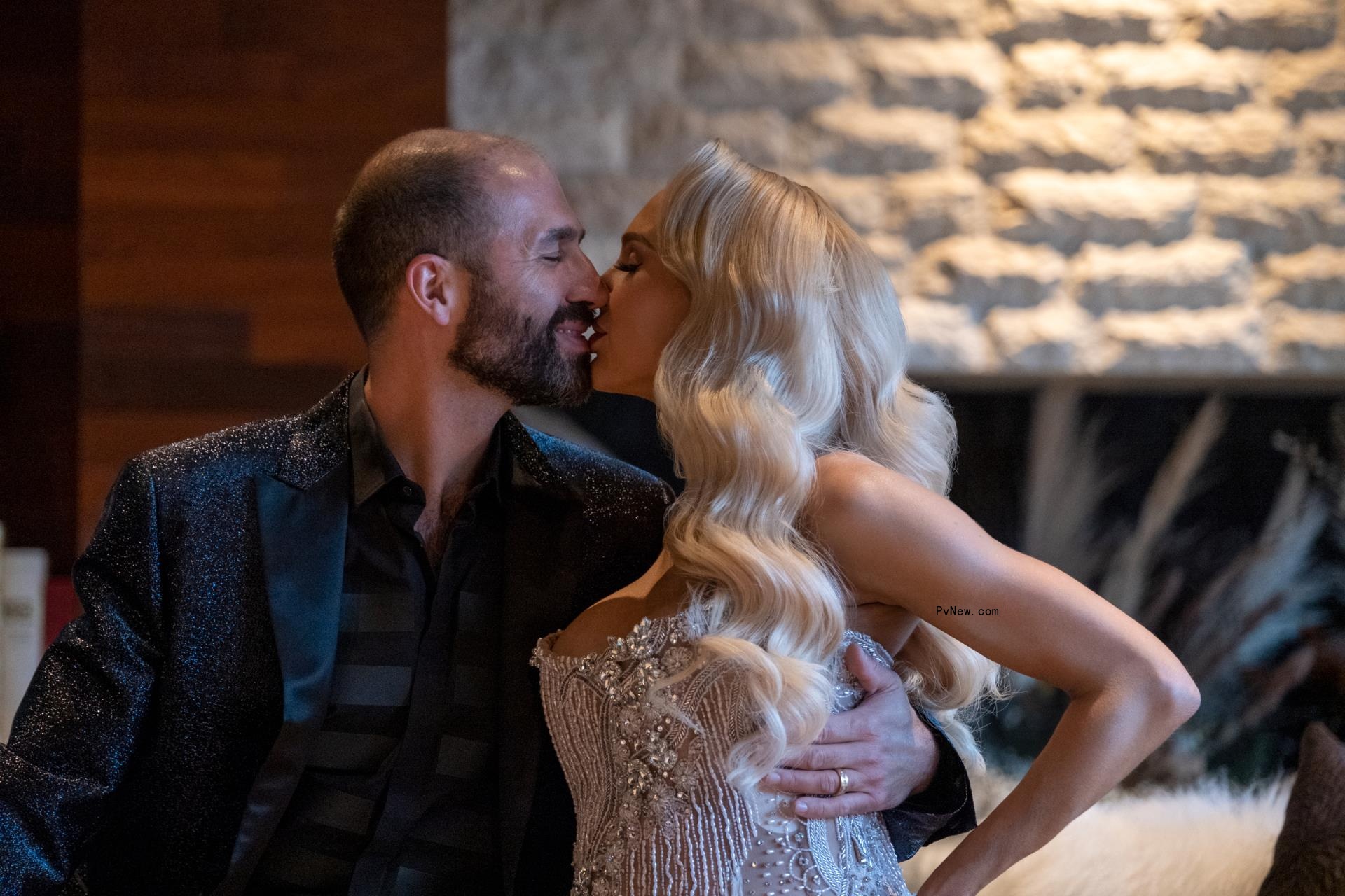 Christian Richard and Christine Quinn kissing.