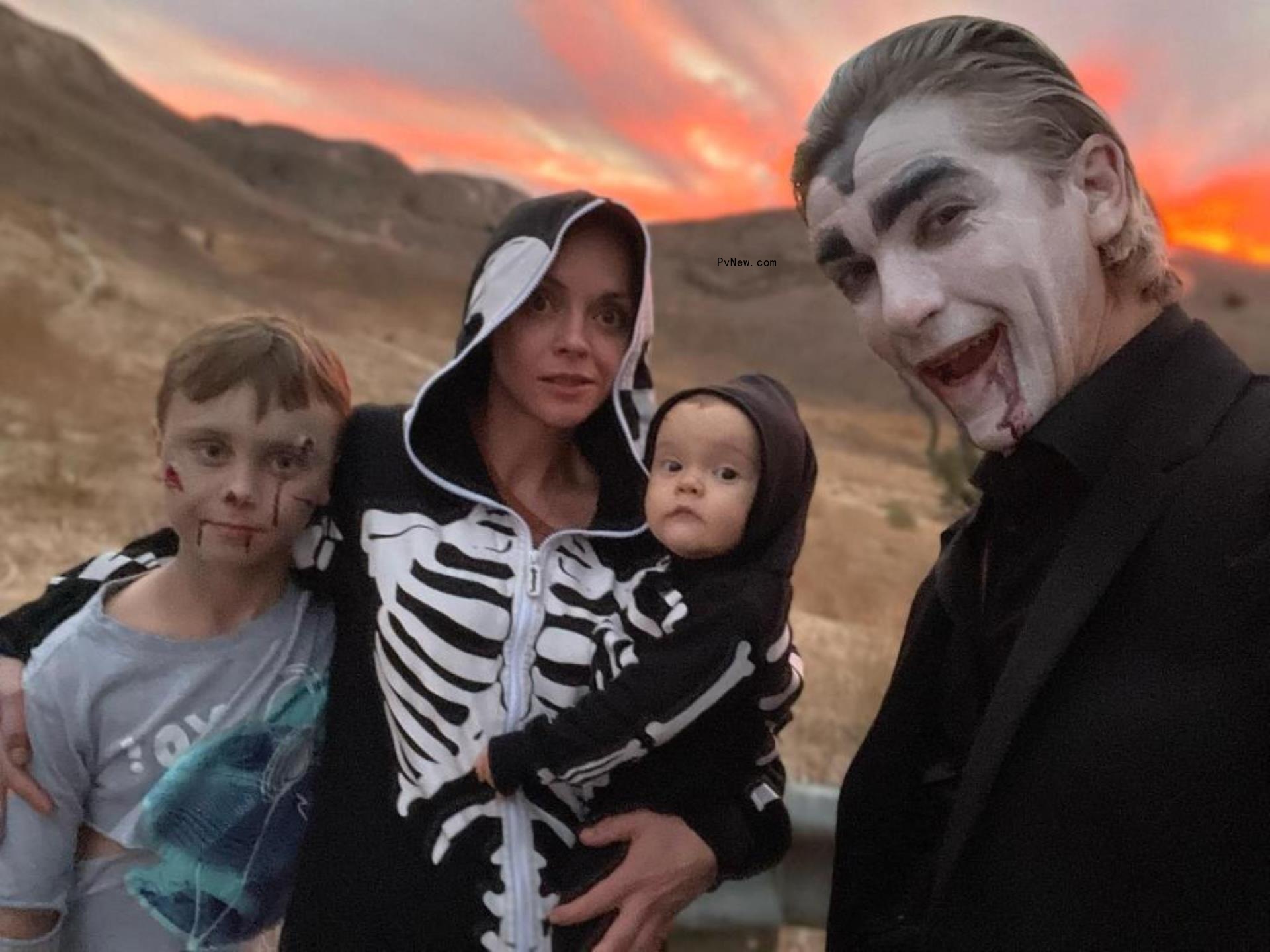Christina Ricci and family of four pose in Halloween costumes. 