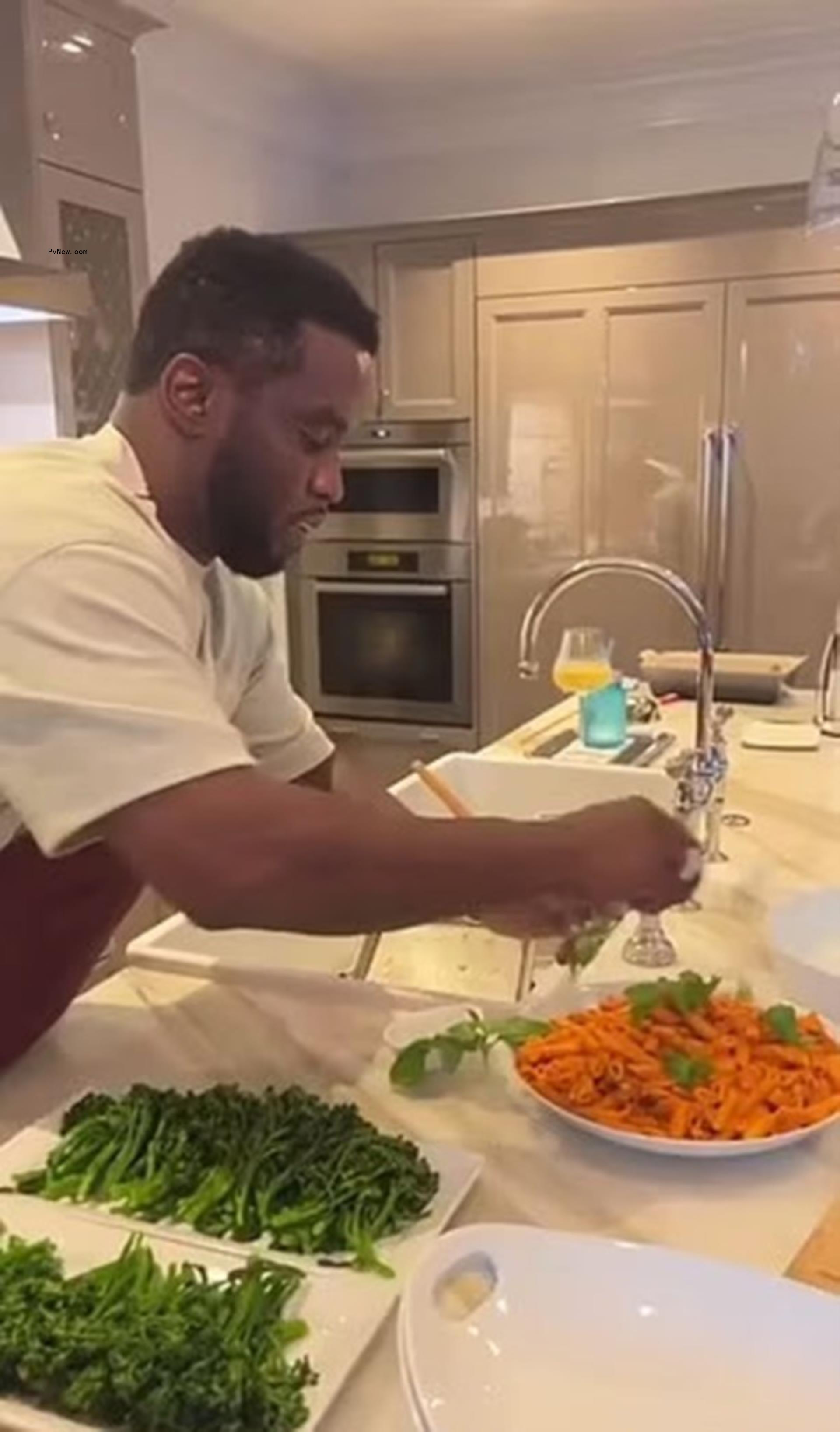 Diddy cooking in his kitchen.