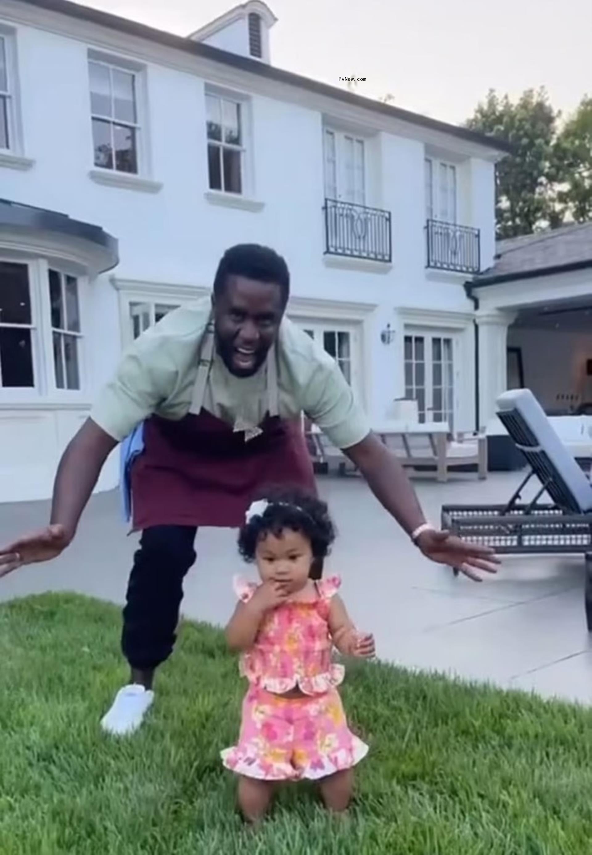Diddy and daughter Love in his backyard.
