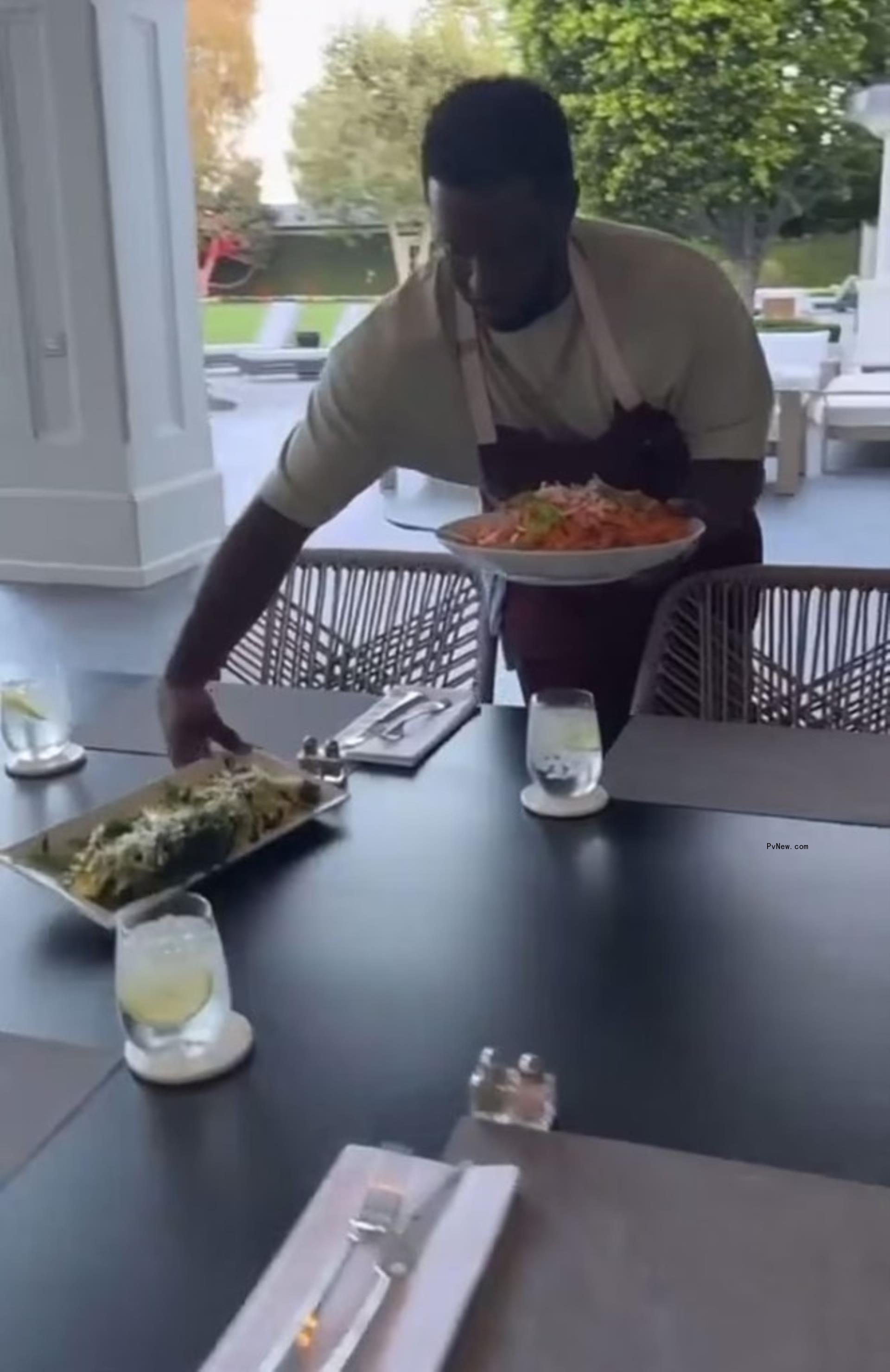 Diddy serving dinner under his verandah.