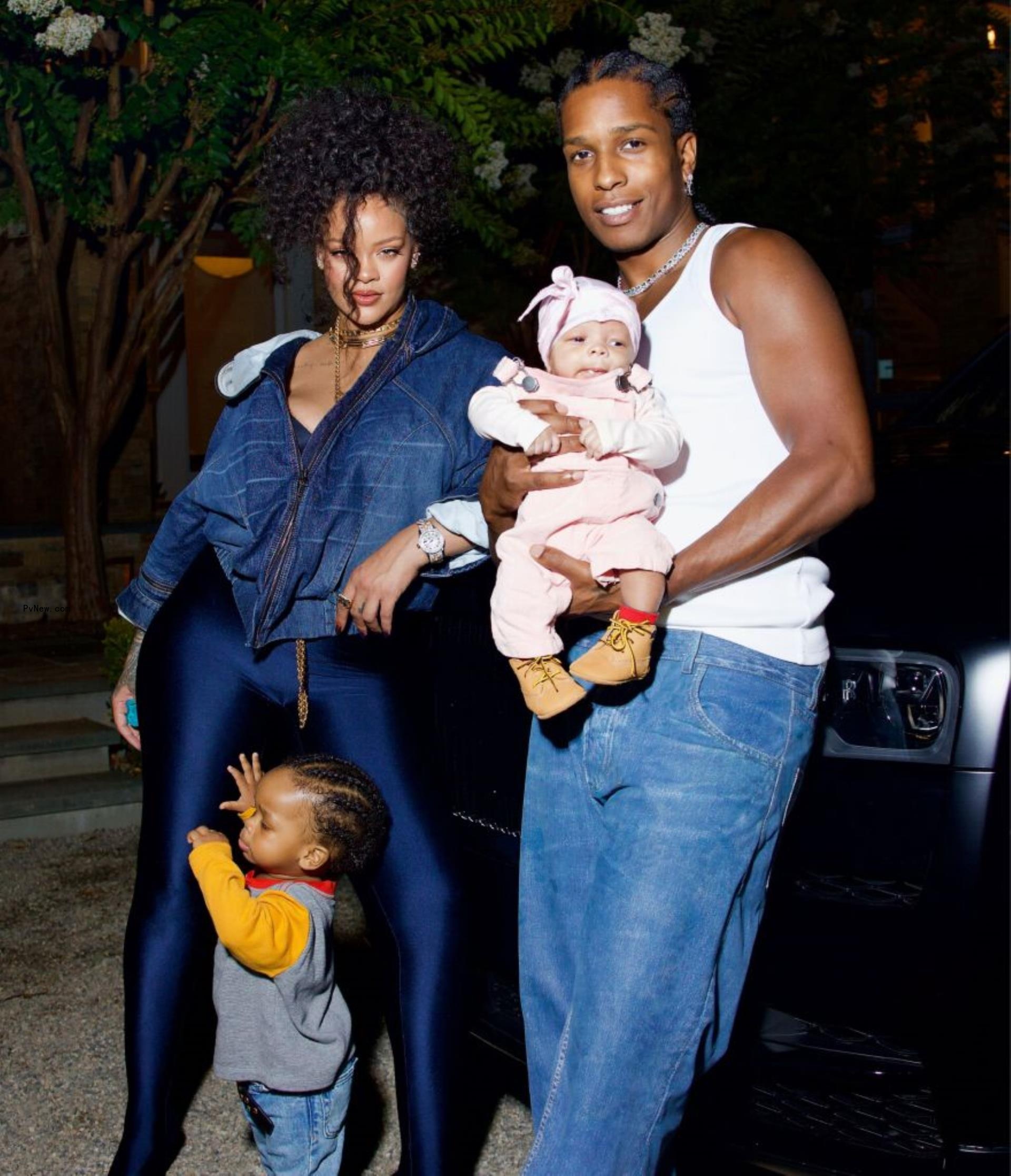 Rihanna and A$AP Rocky pose with their sons.