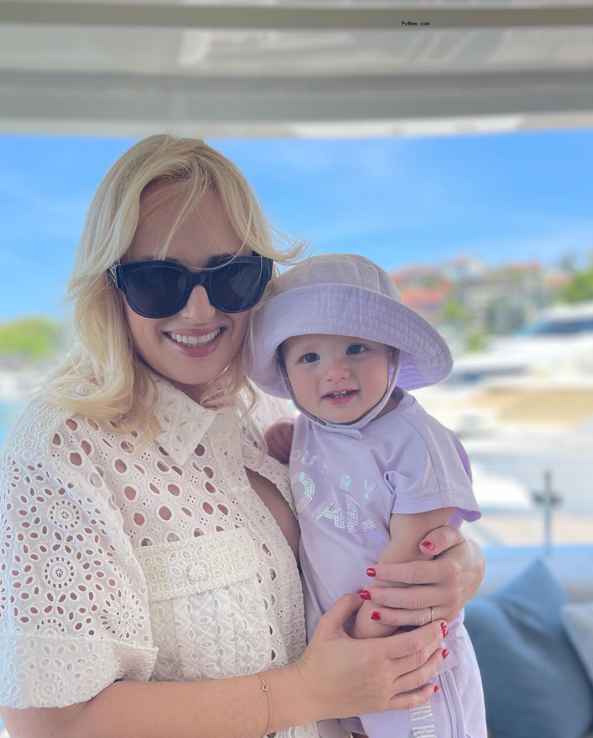 Rebel Wilson holding her daughter.