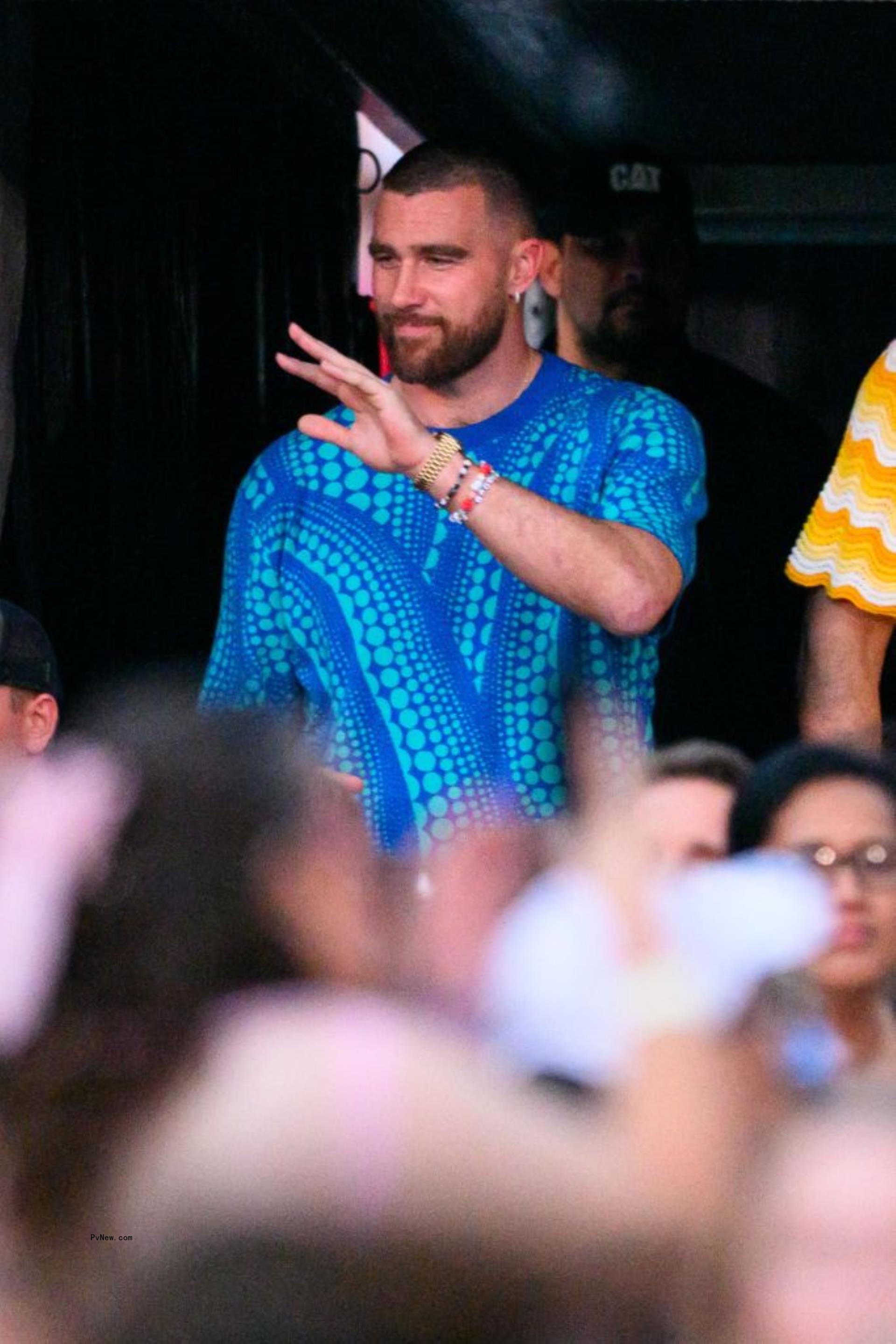 Travis Kelce and Taylor Swift holding hands in the Bahamas.