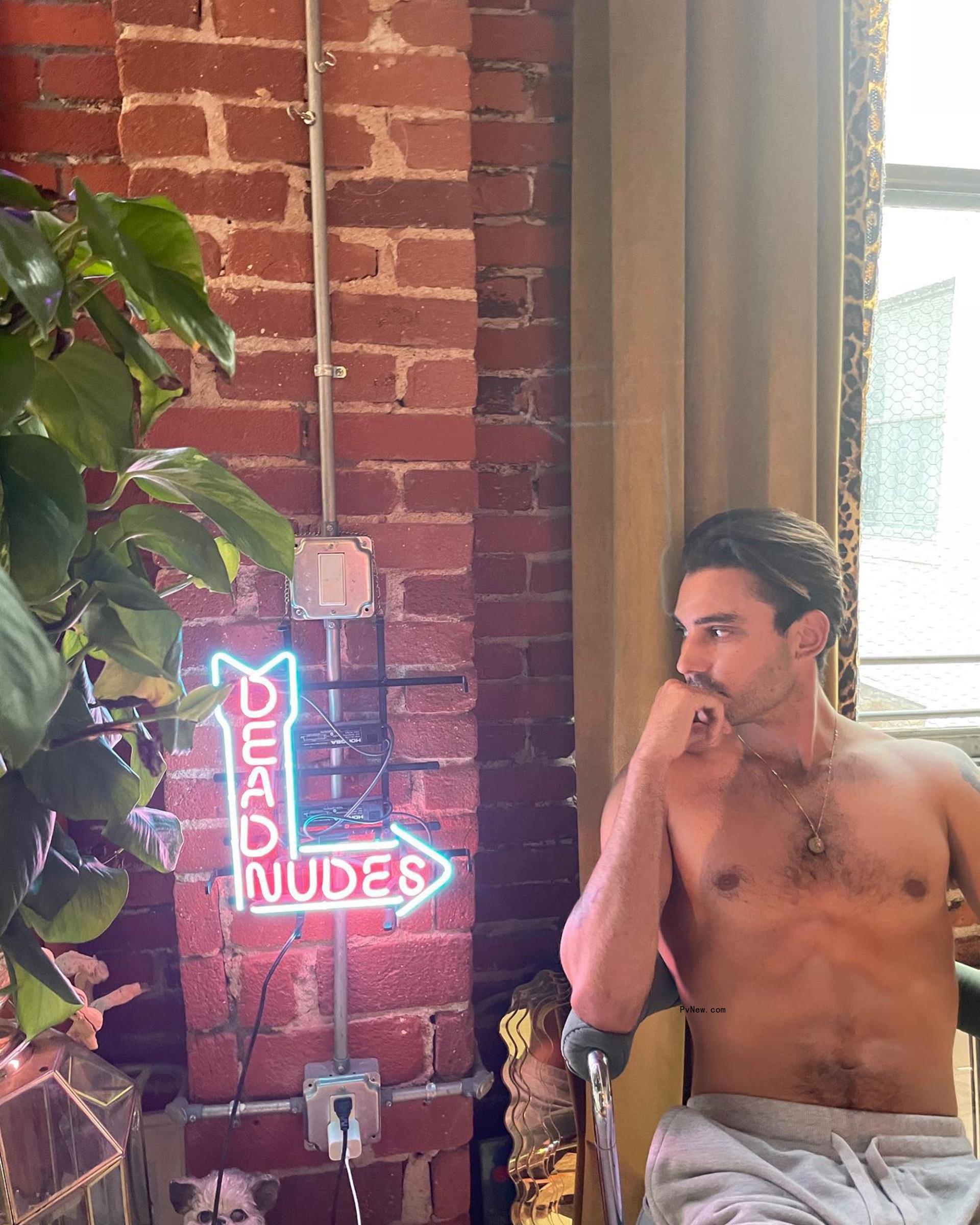 Max Boyens sitting without a shirt