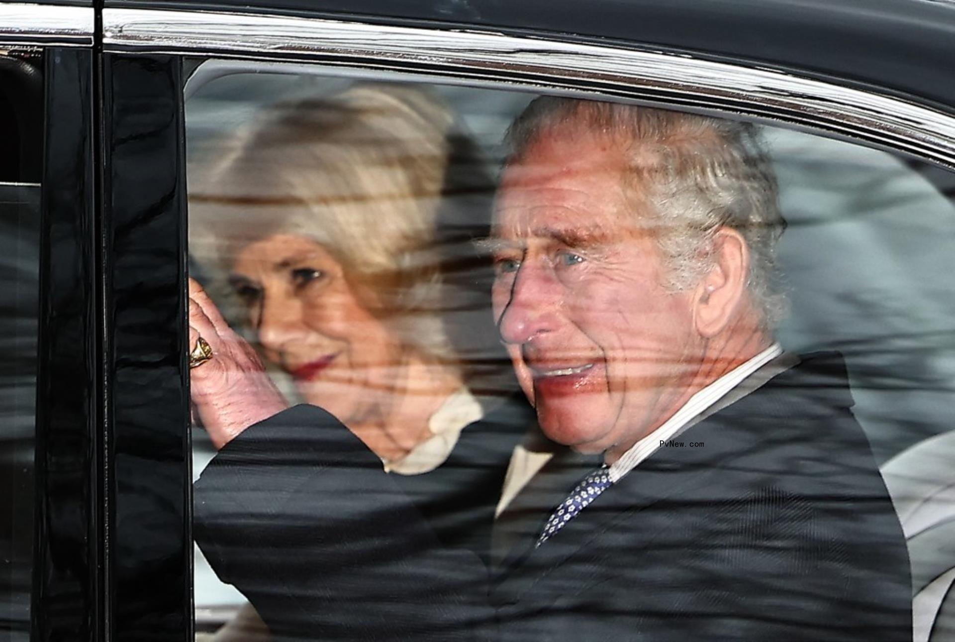 King Charles III and Queen Camilla in a car. 