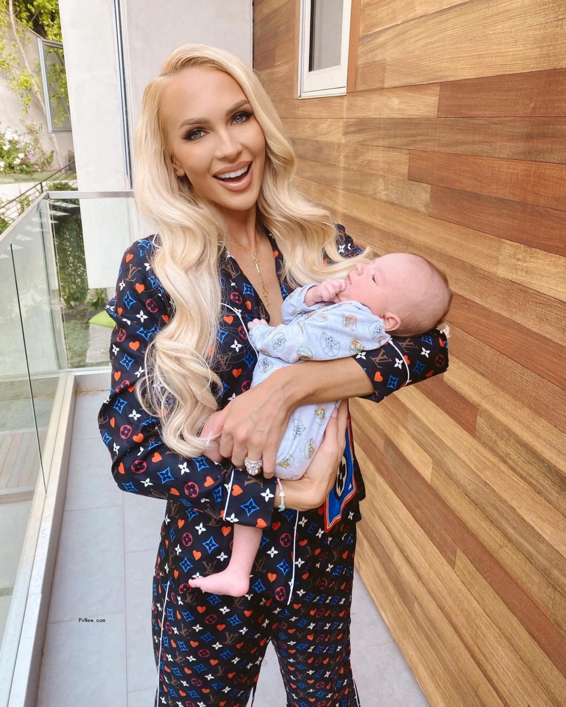 Christine Quinn holding her baby.