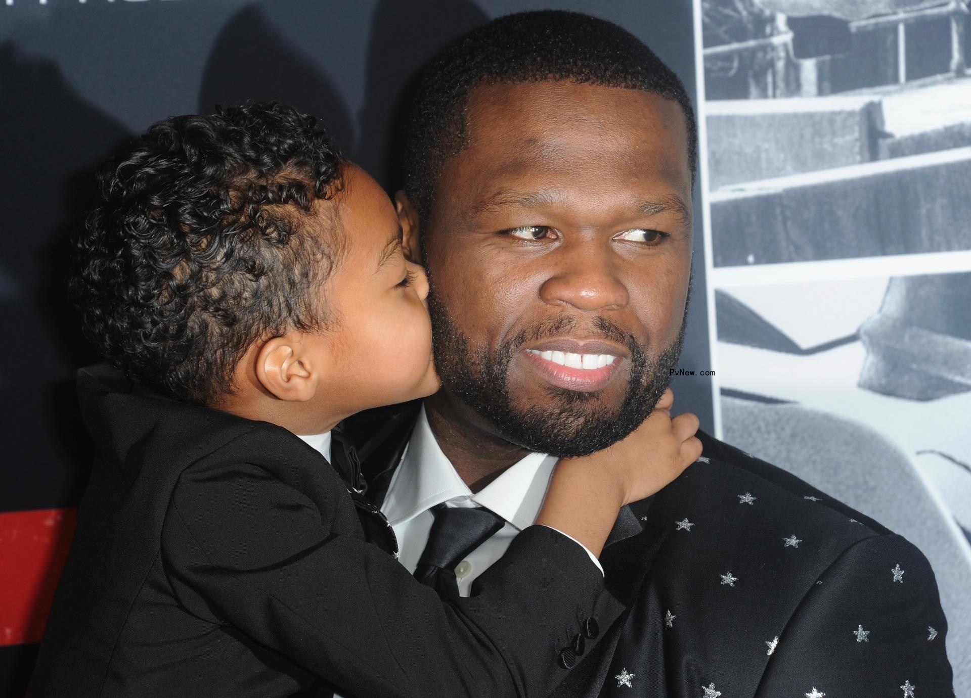50 cent's son sire kissing him on the cheek