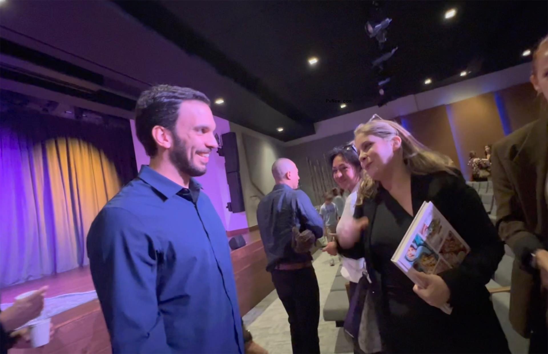 Joaquim Valente talking to a guest.