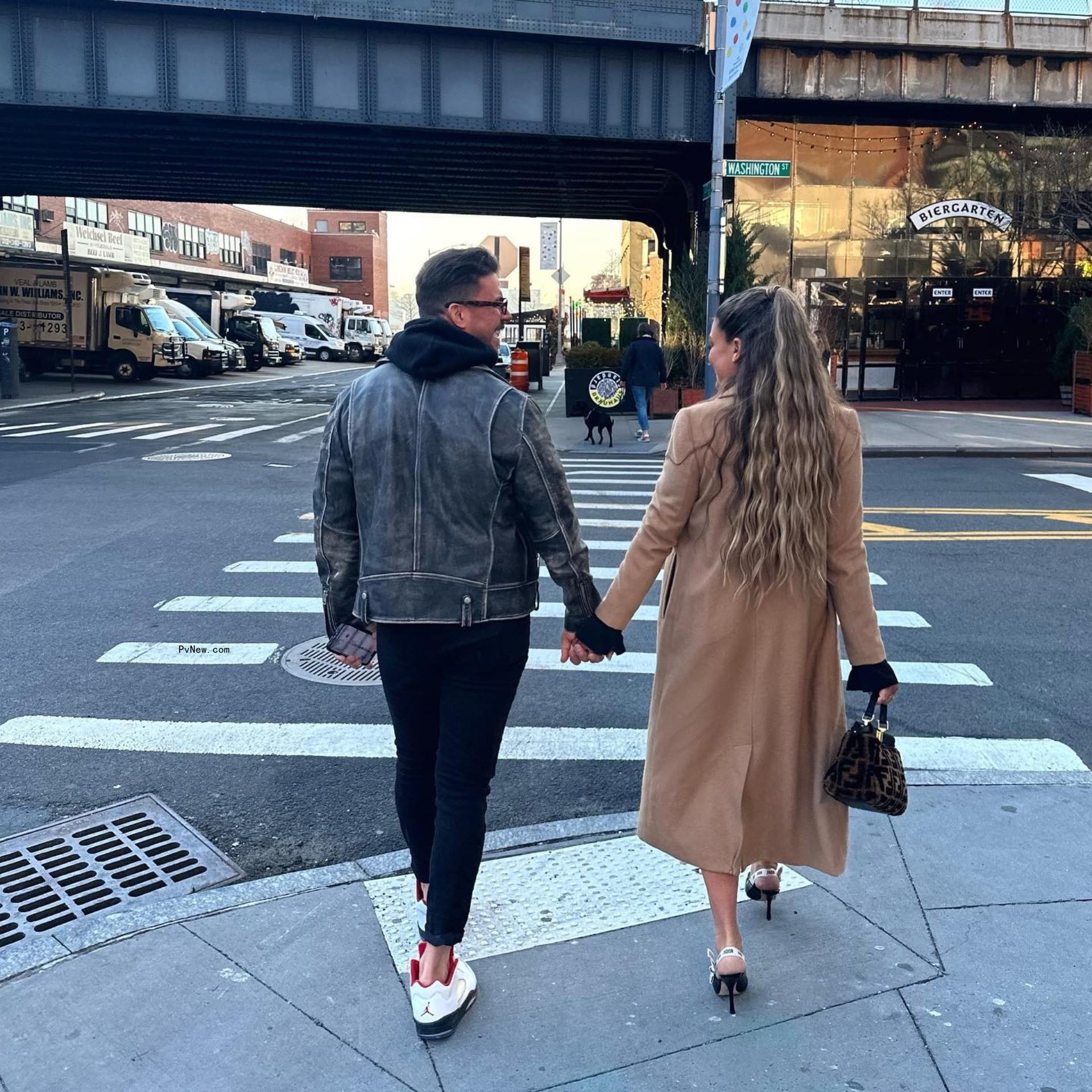 Jax Taylor and Brittany Cartwright holding hands.