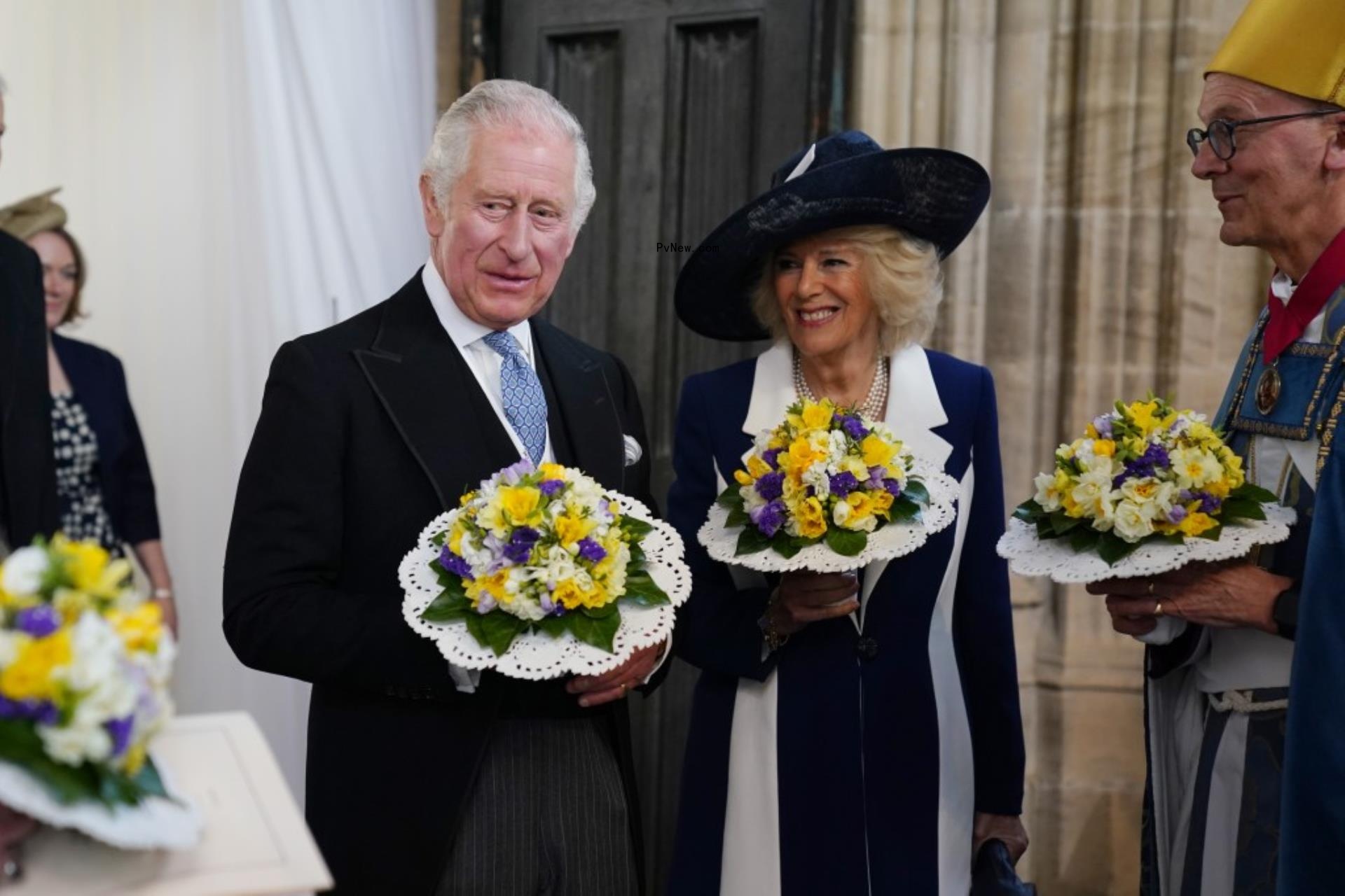 King Charles and Queen Camilla smiling