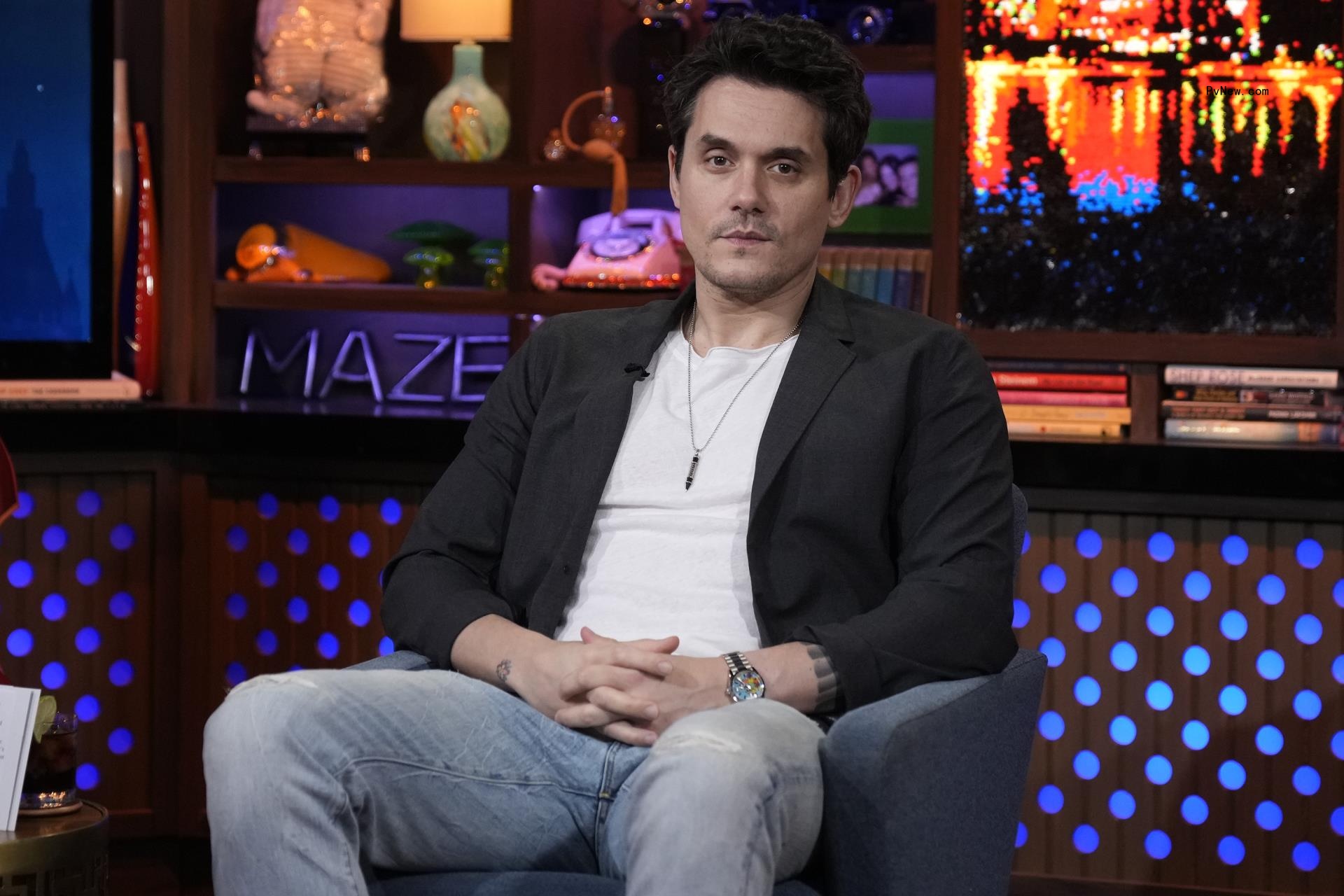 John Mayer sitting on 
