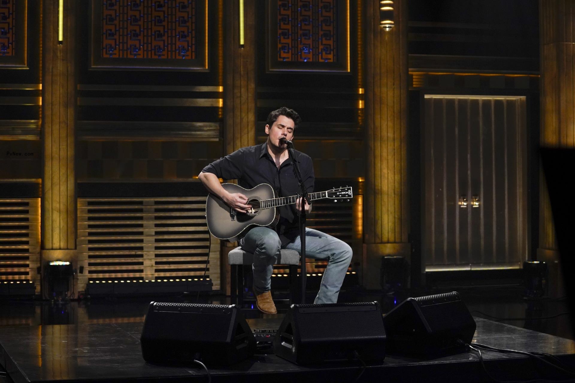 John Payer singing on stage