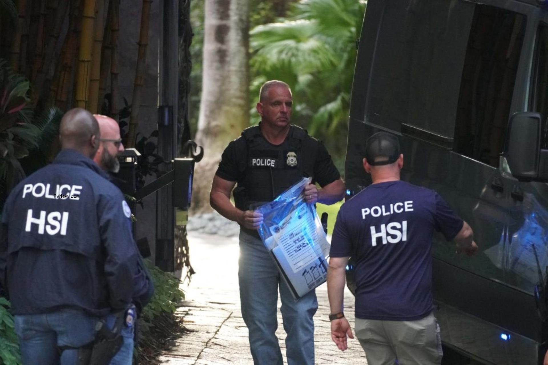 The feds raiding Diddy's home.