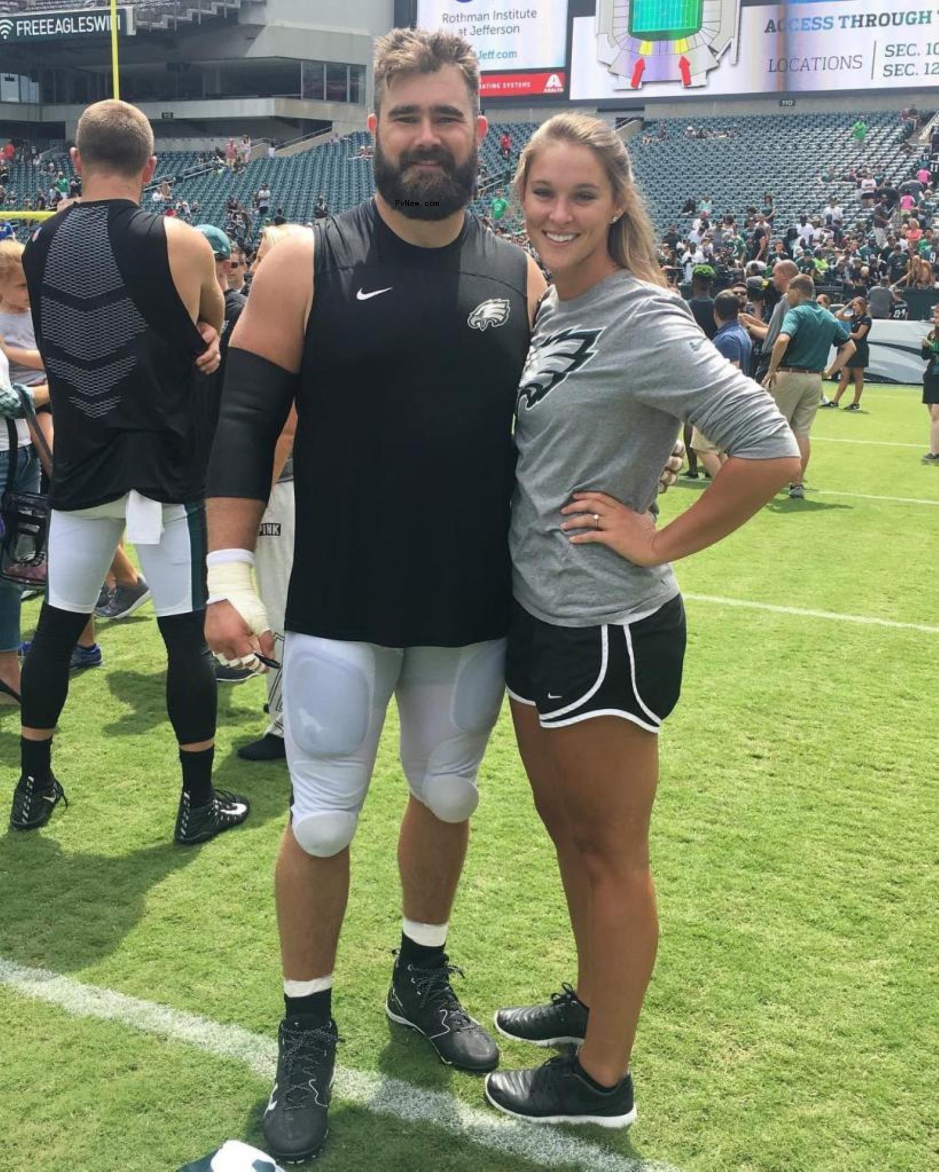 Jason and Kylie Kelce on the football field.