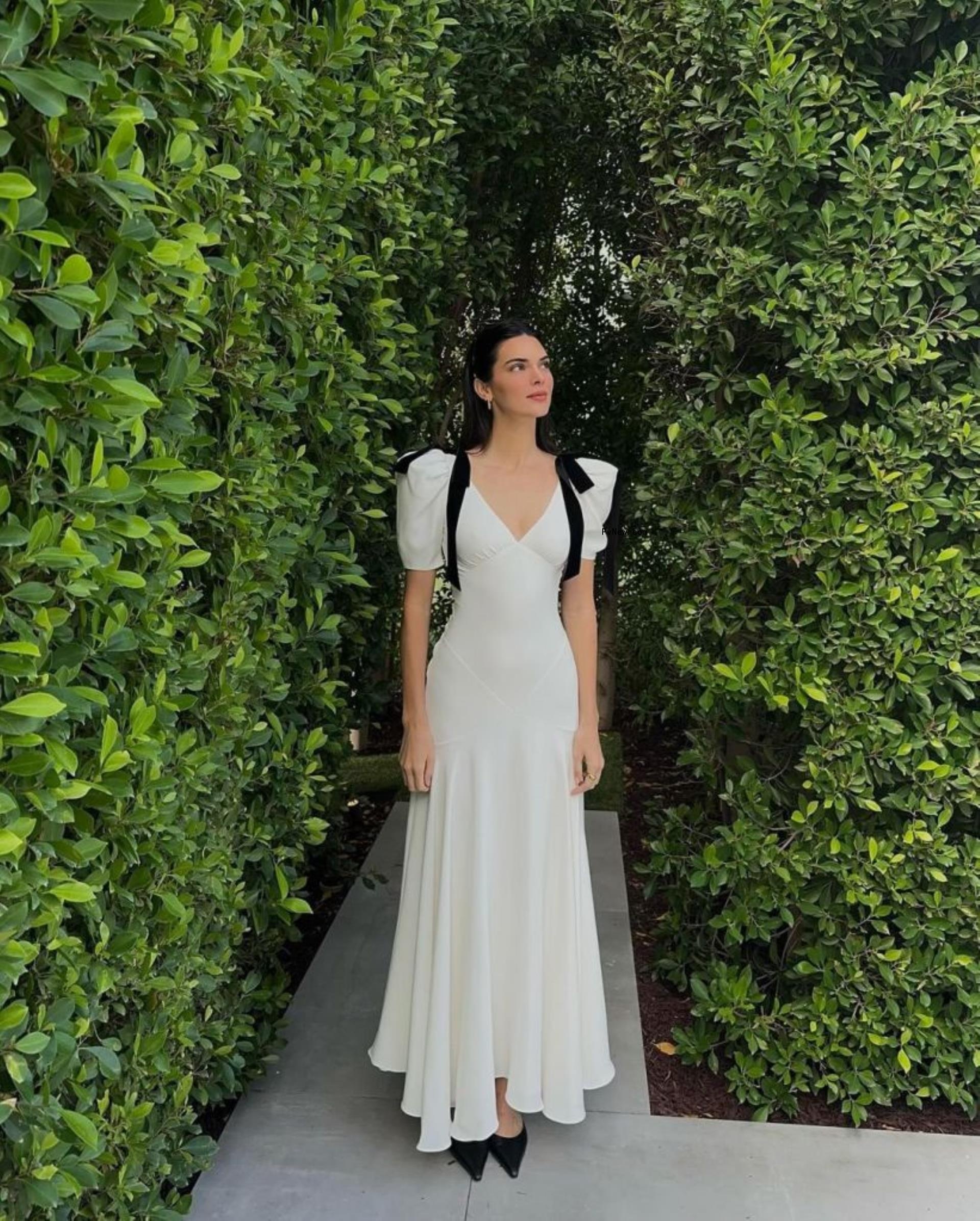 Kendall Jenner standing in front of bushes on Easter.