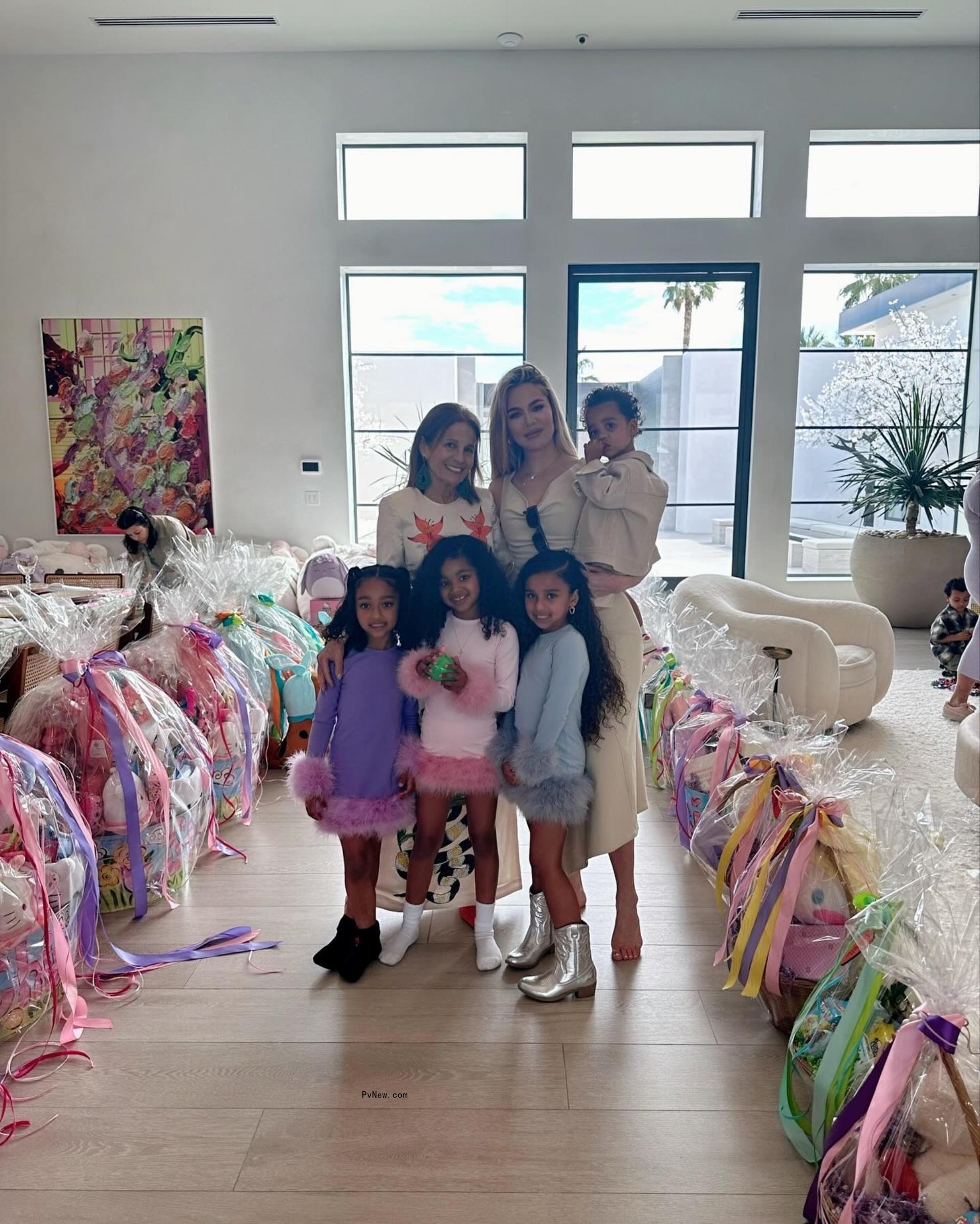 Khloe Kardashian posing with Dream, Chicago and True on Easter
