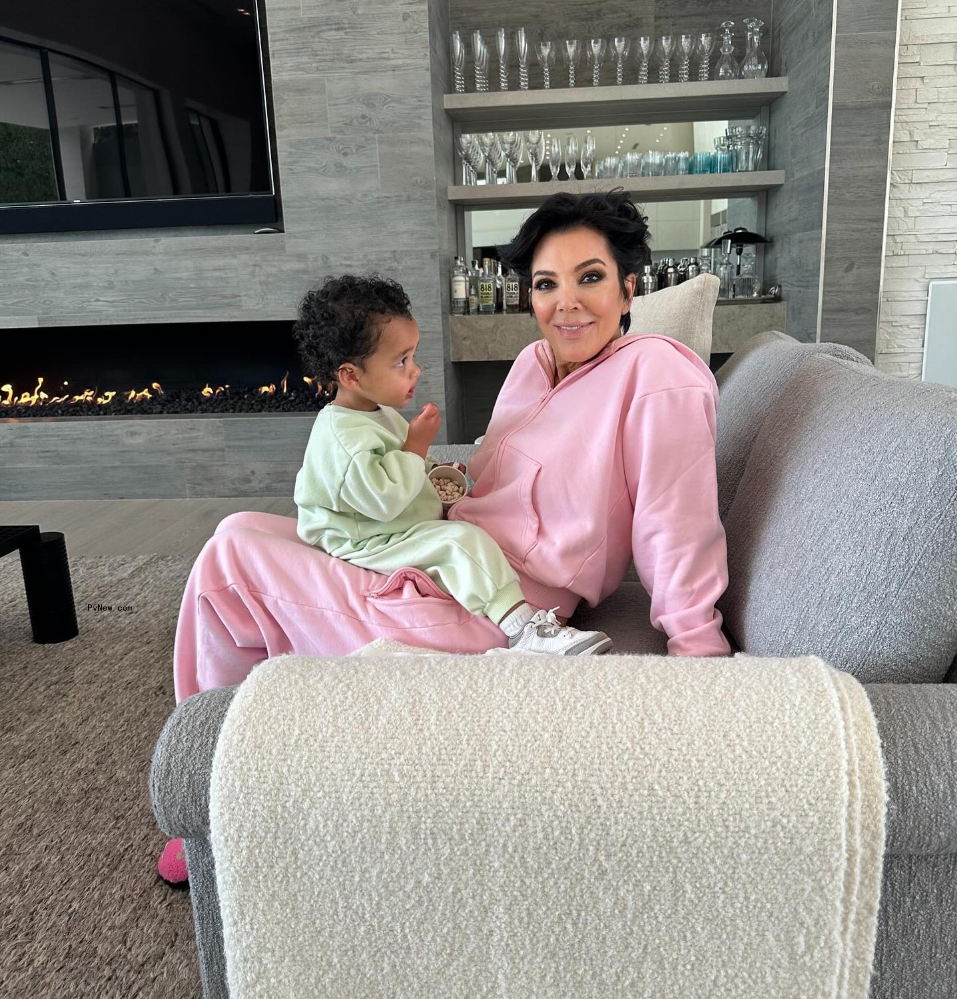 Kris Jenner sitting with Tatum