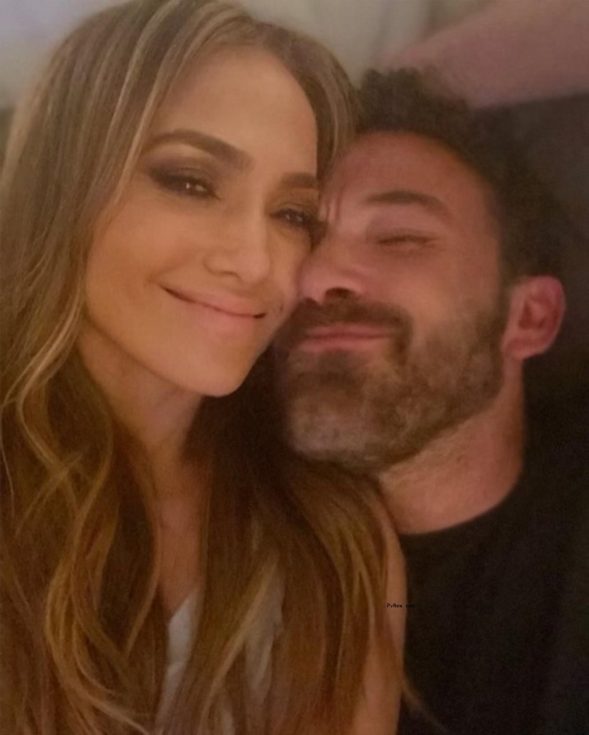 Jennifer Lopez and Ben Affleck smiling in a selfie.