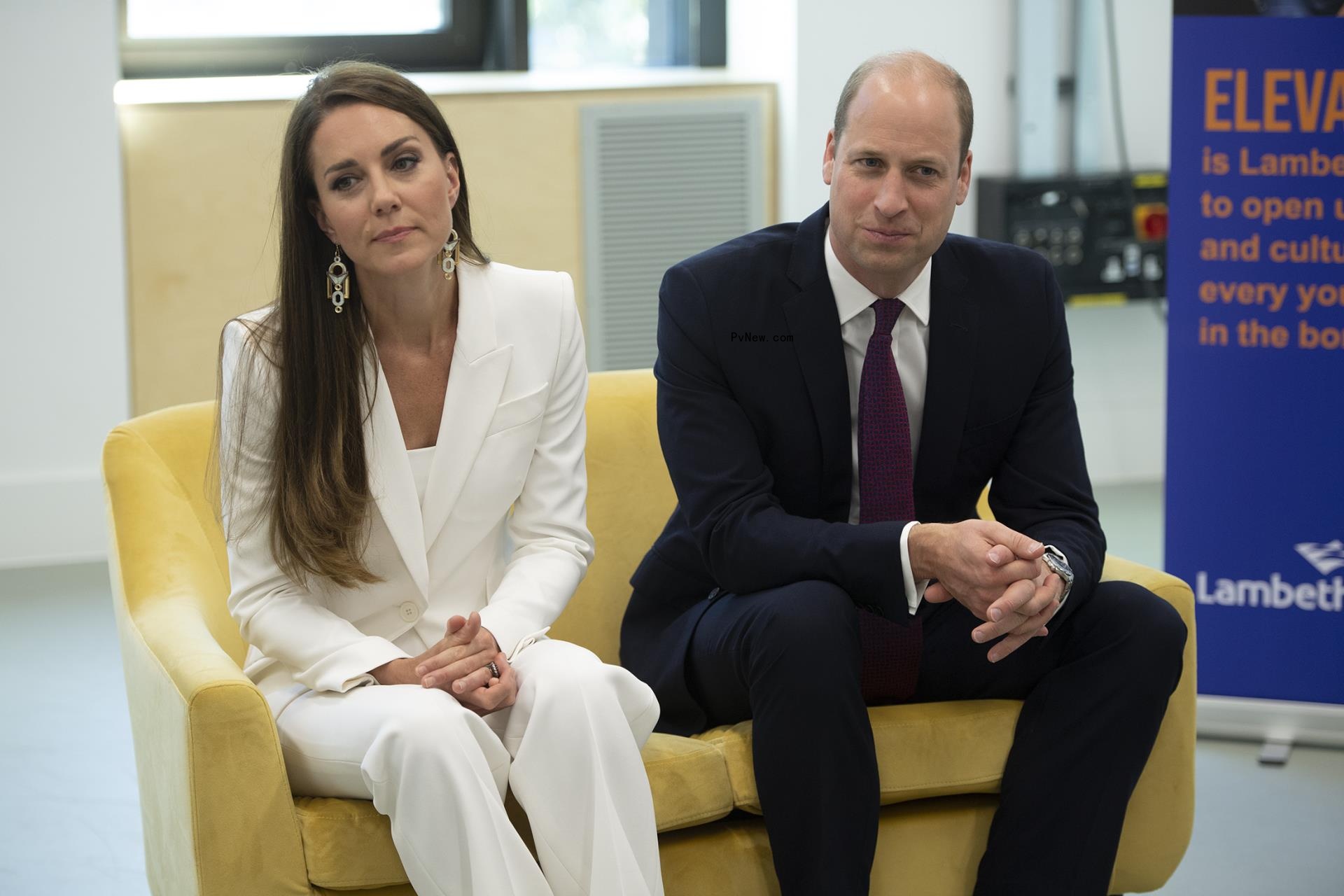 kate middleton and prince william sitting on a couch