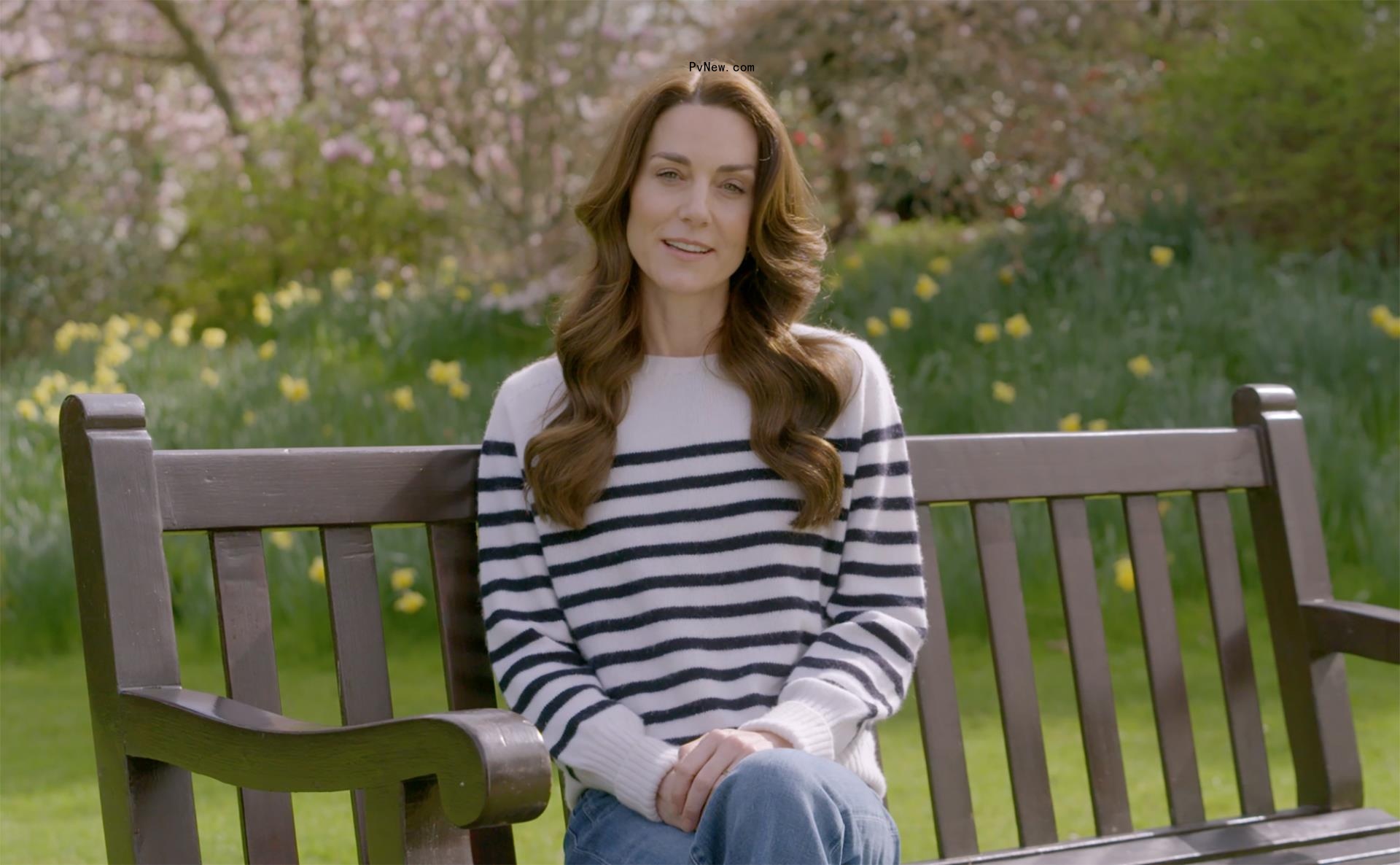 kate middleton sitting on a bench