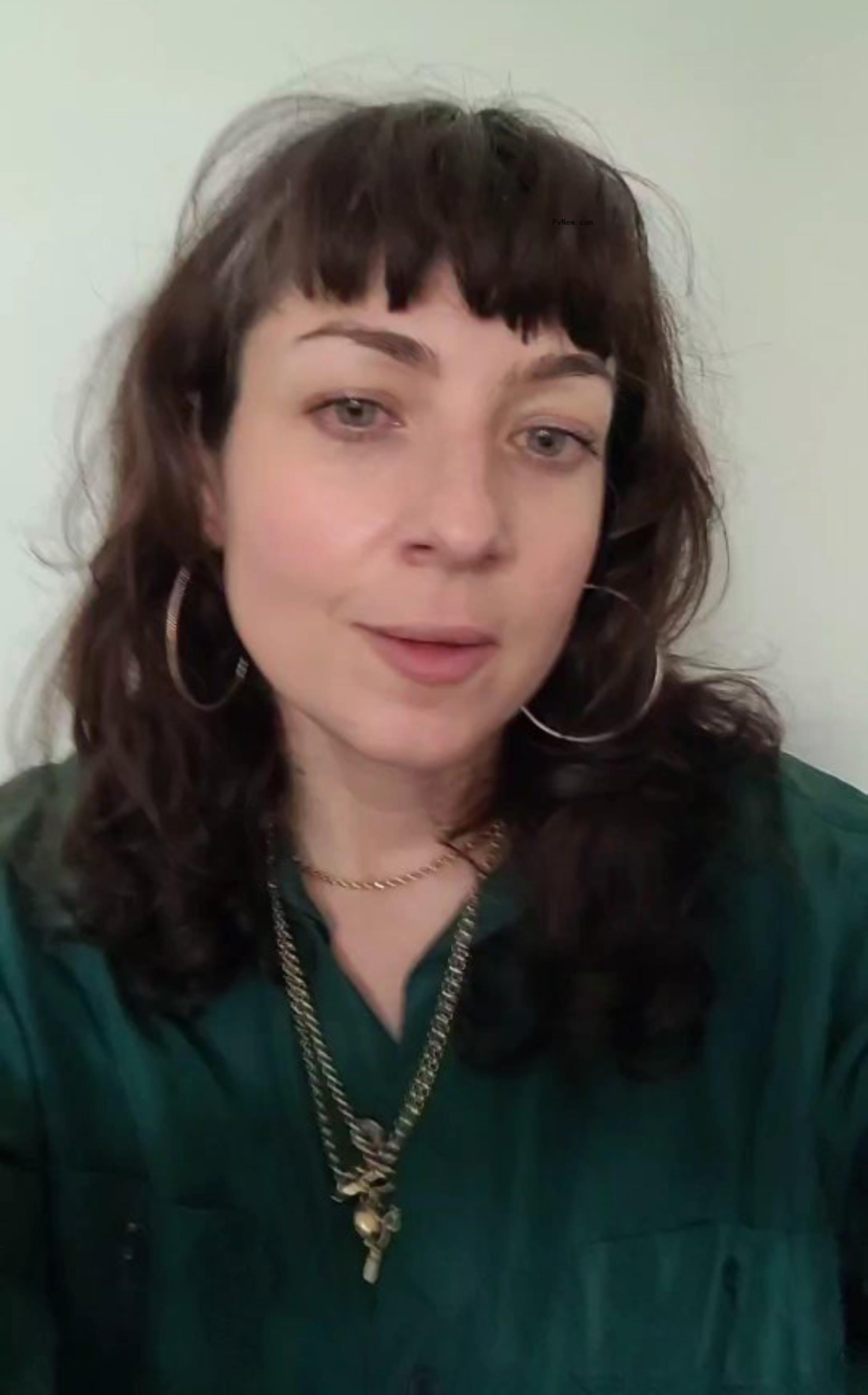 Kate Tomas poses for a selfie